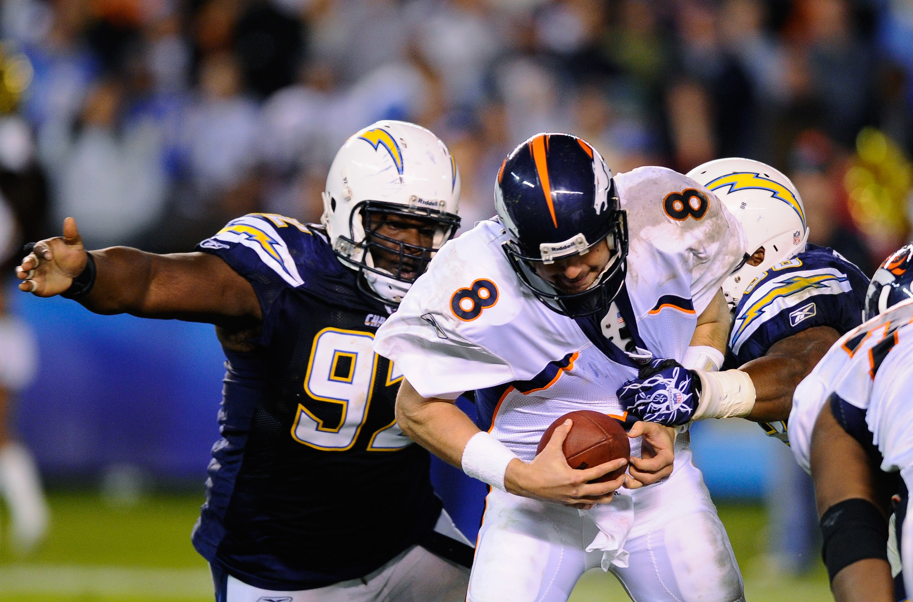 SAN DIEGO - NOVEMBER 22:  Quarterback Kyle Orton #8 of the Denver Broncos is sacked by Larry English #52 of the San Diego Chargers at Qualcomm Stadium on November 22, 2010 in San Diego, California. Chargers defeated the Broncos 35-14.  (Photo by Kevork Dj