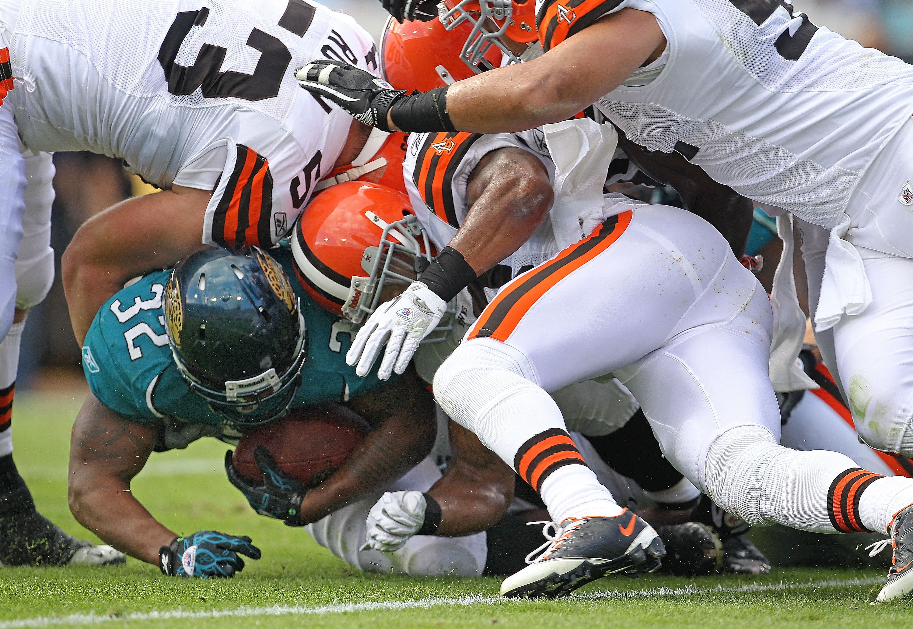 JACKSONVILLE, FL - NOVEMBER 21: Maurice Jones-Drew #32 of the Jacksonville Jaguars is tackled after a run during a game agaisnt the Cleveland Browns at EverBank Field on November 21, 2010 in Jacksonville, Florida.  (Photo by Mike Ehrmann/Getty Images)
