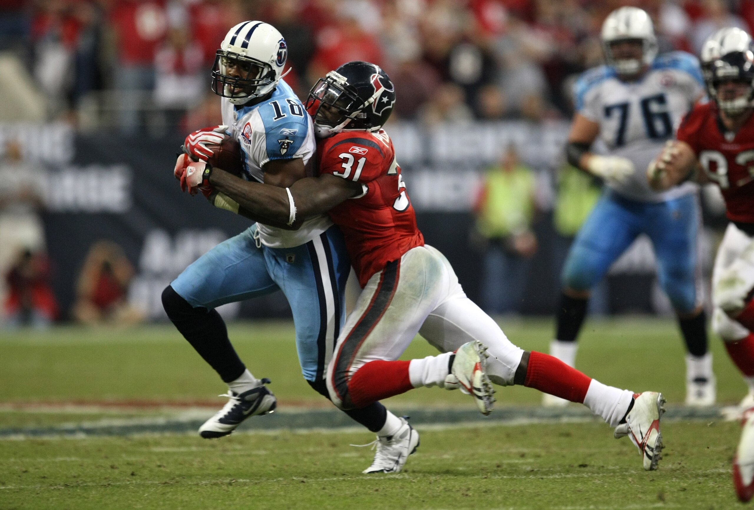 HOUSTON - NOVEMBER 23: Safety Bernard Pollard #31 of the Houston Texans tackles wide receiver Kenny Britt #18 of the Tennessee Titans on November 23, 2009 at Reliant Stadium in Houston, Texas. The Titans won 20-17. (Photo by Stephen Dunn/Getty Images) HOUSTON - NOVEMBER 23: Safety Bernard Pollard #31 of the Houston Texans tackles wide receiver Kenny Britt #18 of the Tennessee Titans on November 23, 2009 at Reliant Stadium in Houston, Texas. The Titans won 20-17. (Photo by Stephen Dunn/Getty Images)