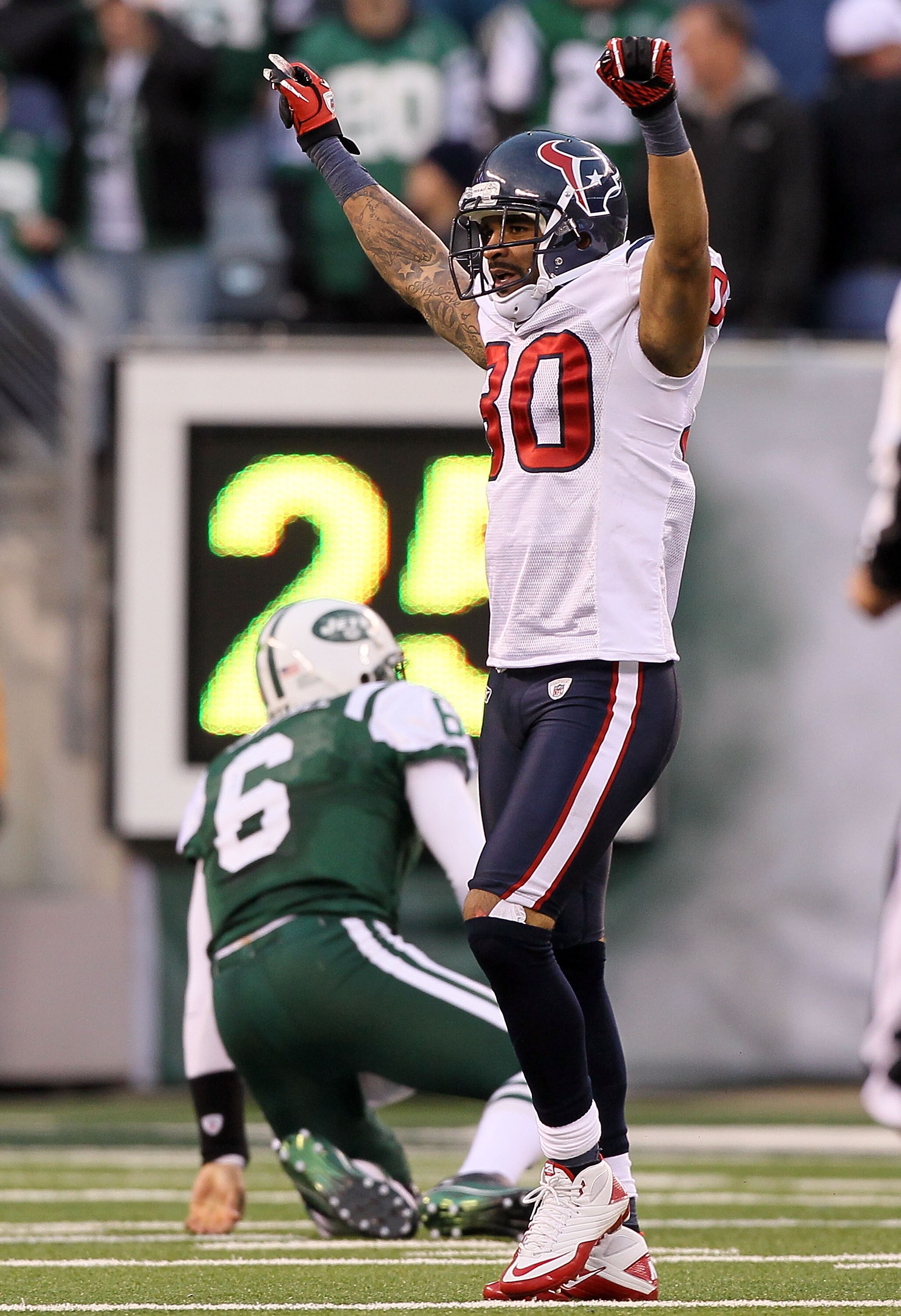 EAST RUTHERFORD, NJ - NOVEMBER 21:  Jason Allen #30 of the Houston Texans celebrates after Mark Sanchez #6 of the New York Jets threw a fourth quarter interception on November 21, 2010 at the New Meadowlands Stadium in East Rutherford, New Jersey. The Jet