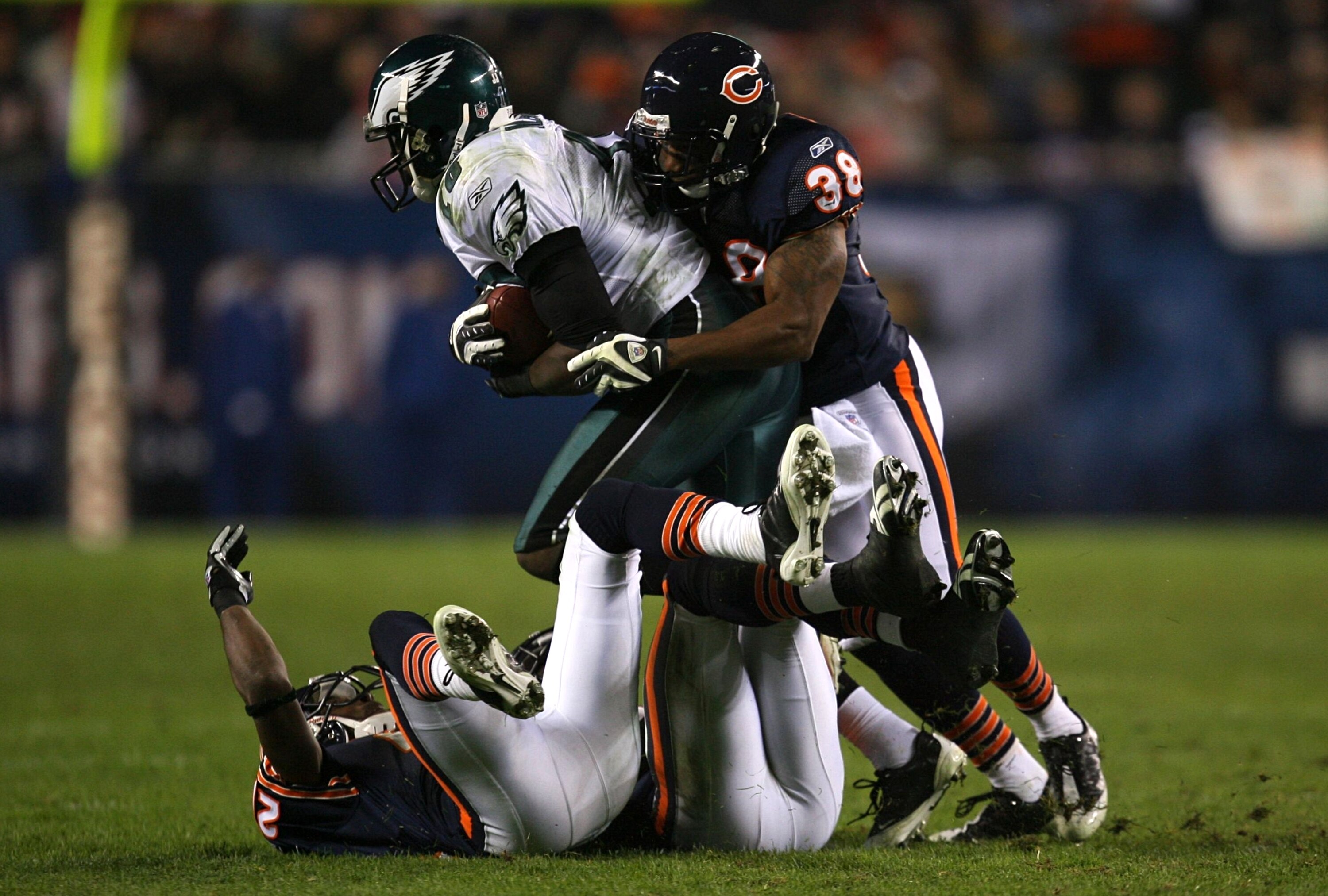 CHICAGO - NOVEMBER 22: Danieal Manning #38 of the Chicago Bears hits and tackles Jeremy Maclin #15 of the Philadelphia Eagles as Maclin makes a reception in the second quarter at Soldier Field on November 22, 2009 in Chicago, Illinois.  (Photo by Jonathan