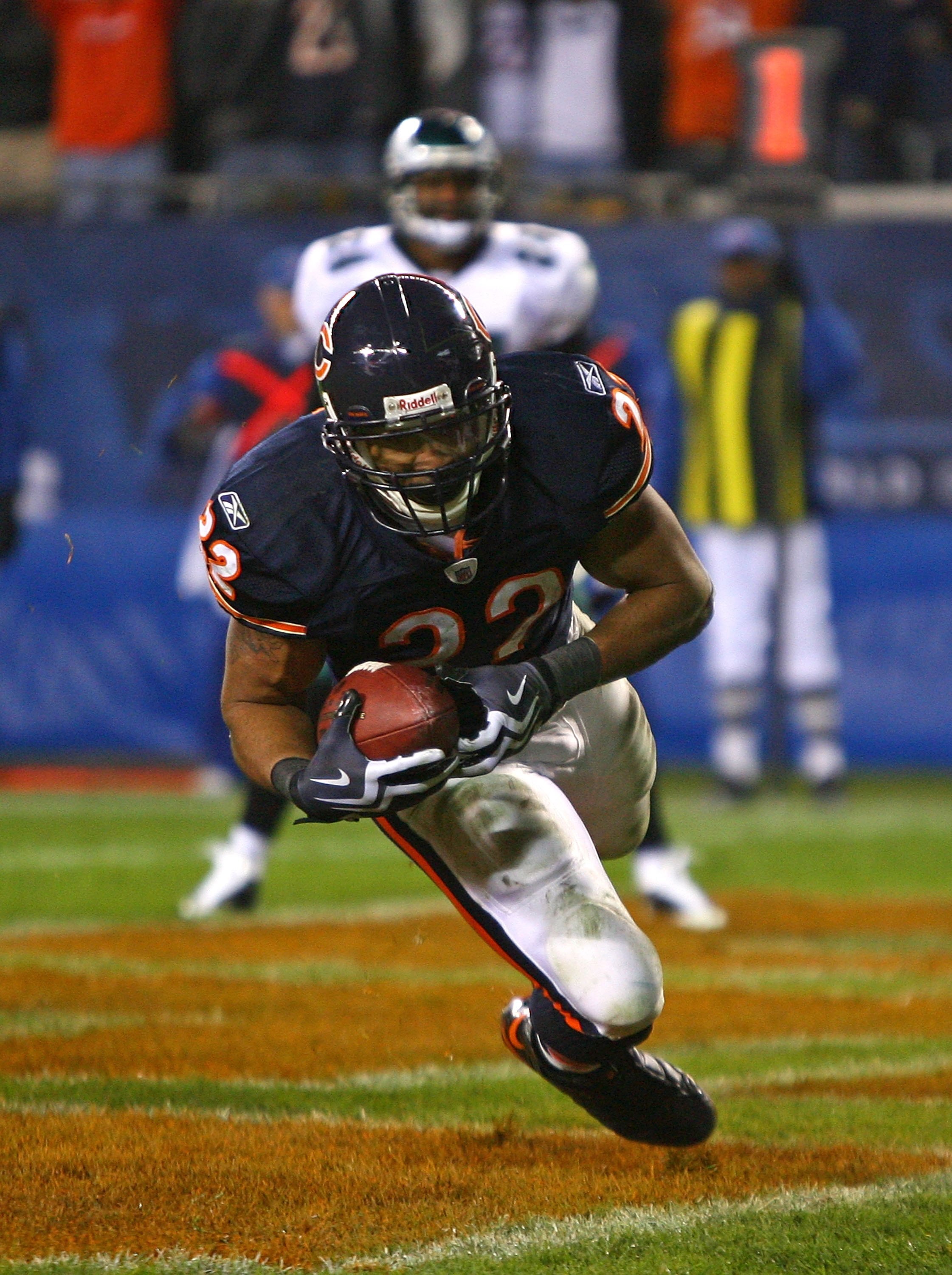 CHICAGO - NOVEMBER 22: Matt Forte #22 of the Chicago Bears falls into the end zone for a touchdown against the Philadelphia Eagles at Soldier Field on November 22, 2009 in Chicago, Illinois. The Eagles defeated the Bears 24-20. (Photo by Jonathan Daniel/G
