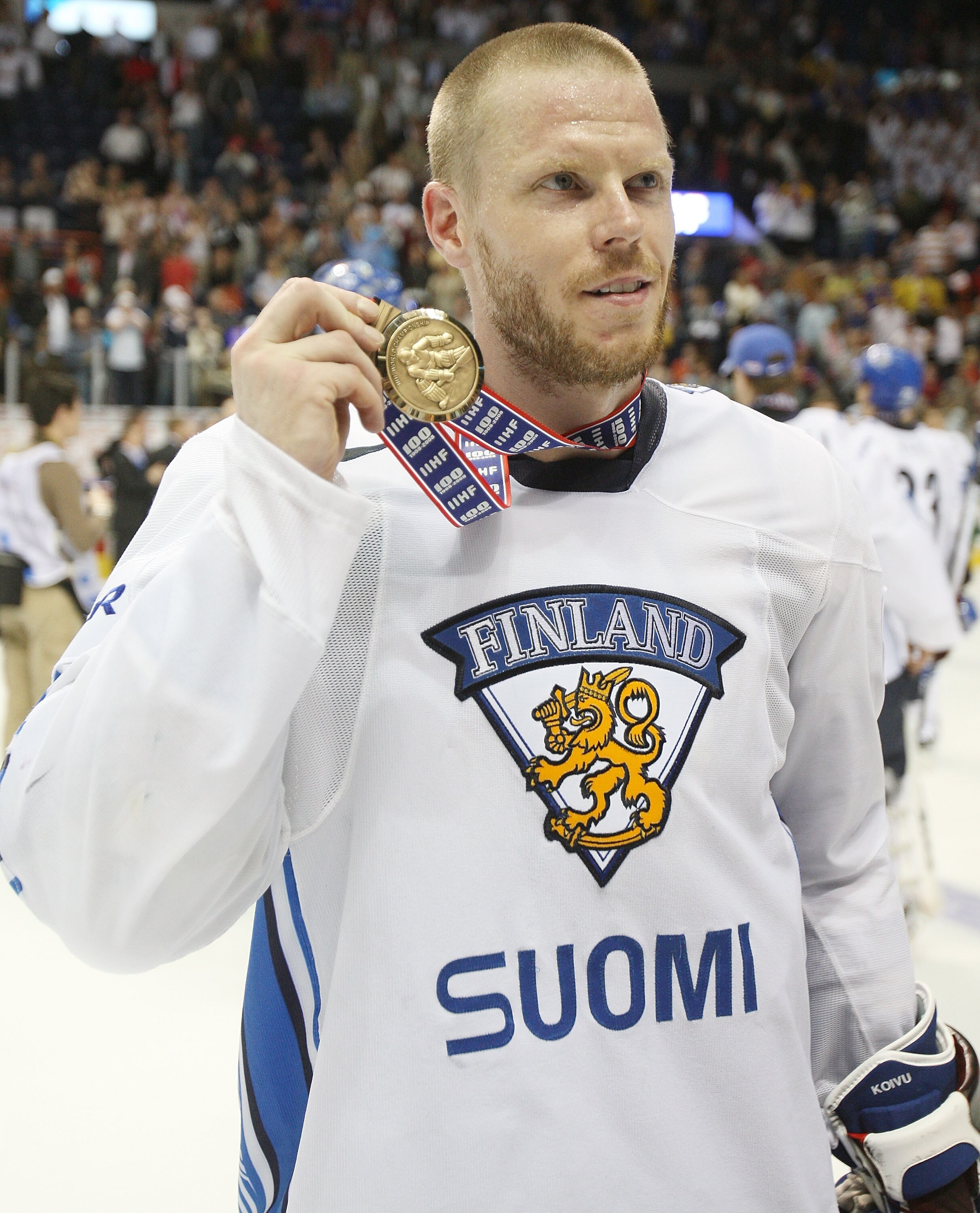 QUEBEC CITY, CANADA - MAY 17: Saku Koivu #11 of Finland shows off his bronze medal after Finland won the Bronze Medal Game of the International Ice Hockey Federation World Championship at the Colisee Pepsi on May 17, 2008 in Quebec City, Canada.  (Photo b