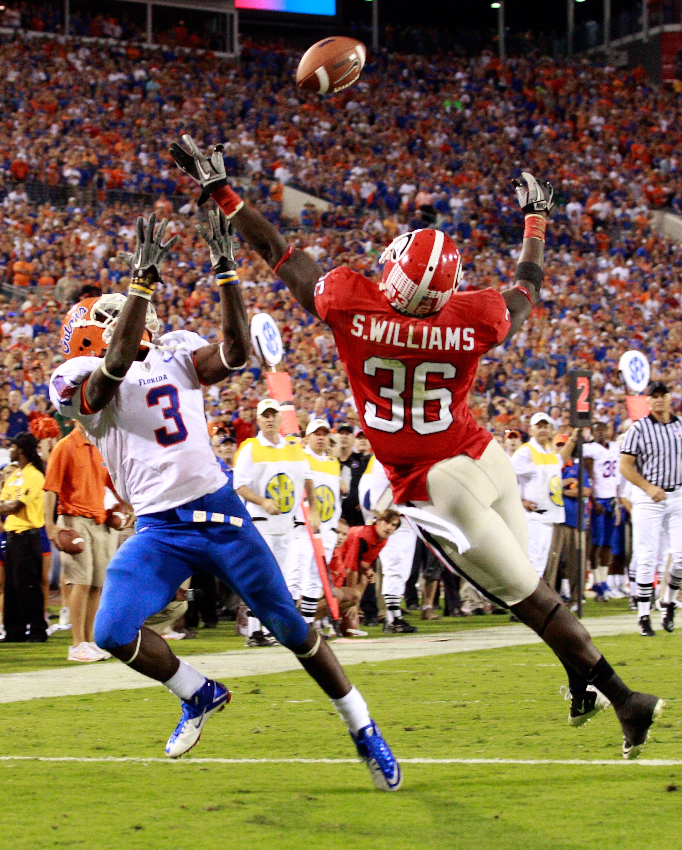 JACKSONVILLE, FL - OCTOBER 30:  Chris Rainey #3 of the Florida Gators attempts to catcha pass against Shawn Williams #36 of the Georgia Bulldogs during the game at EverBank Field on October 30, 2010 in Jacksonville, Florida.  (Photo by Sam Greenwood/Getty