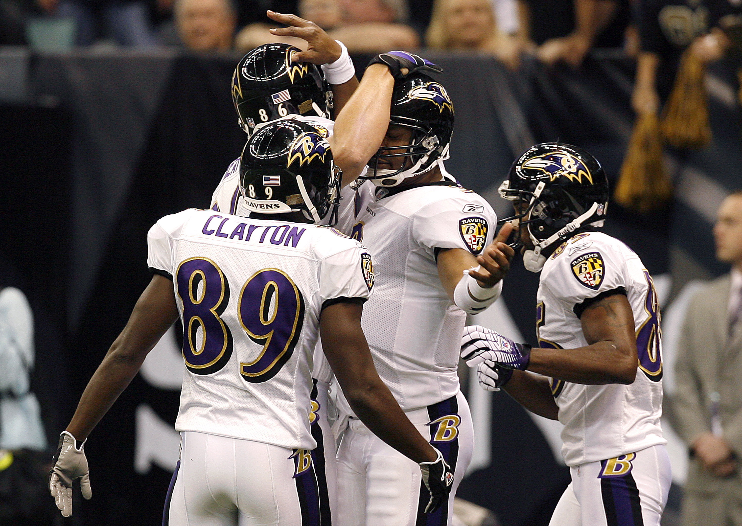 Baltimore quarterback Steve McNair (center, right) celebrates with Mark Clayton (89), Todd Heap (86) and Derrick Mason (right) after McNair's touchdown during the first half of the Ravens 35-22 win over New Orleans  Sunday, October 29, 2006, at the Superd