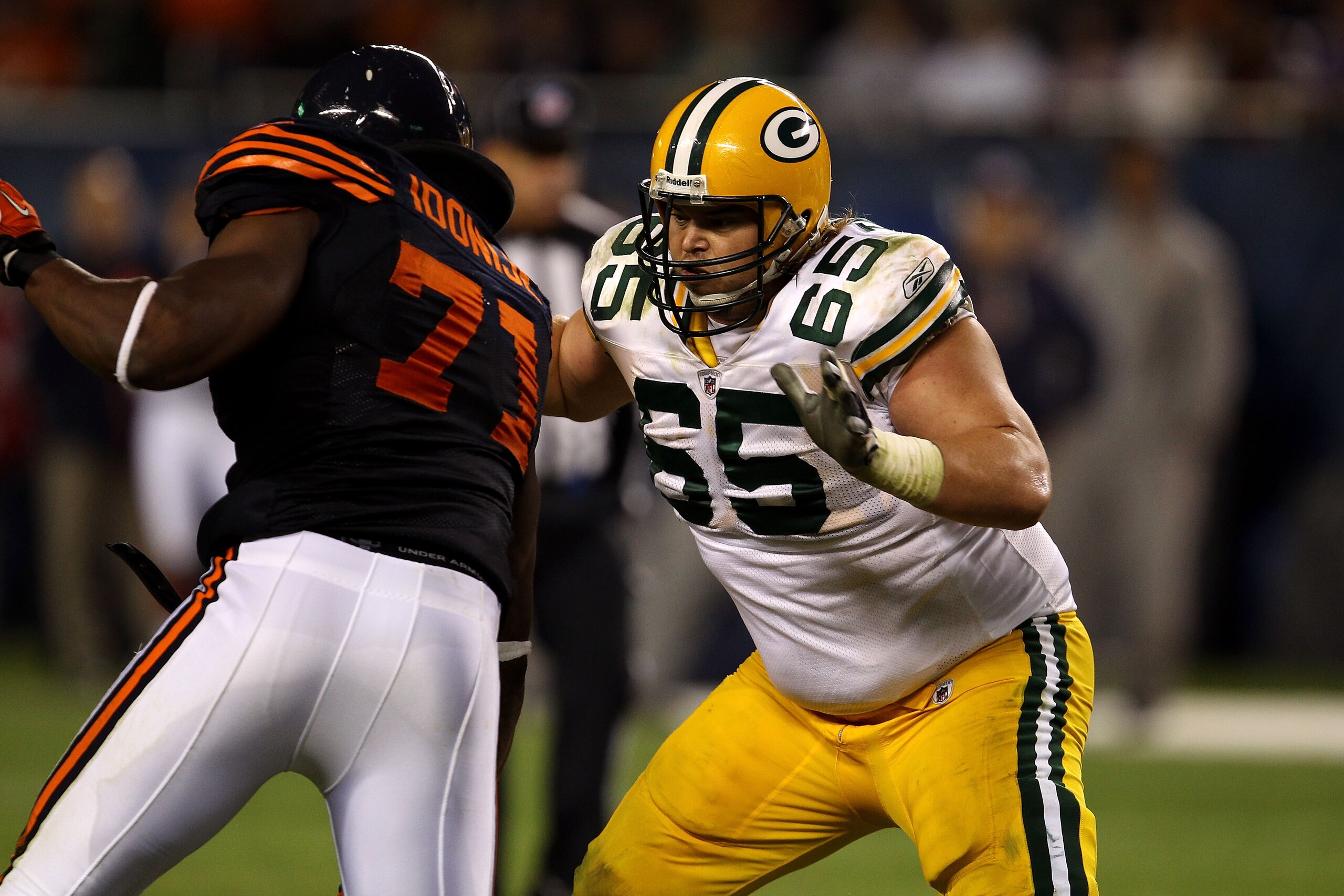 CHICAGO - SEPTEMBER 27: Offensive guard Mark Tauscher #65 of the Green Bay Packers blocks against the Chicago Bears at Soldier Field on September 27, 2010 in Chicago, Illinois. (Photo by Jonathan Daniel/Getty Images) CHICAGO - SEPTEMBER 27: Offensive guard Mark Tauscher #65 of the Green Bay Packers blocks against the Chicago Bears at Soldier Field on September 27, 2010 in Chicago, Illinois. (Photo by Jonathan Daniel/Getty Images)
