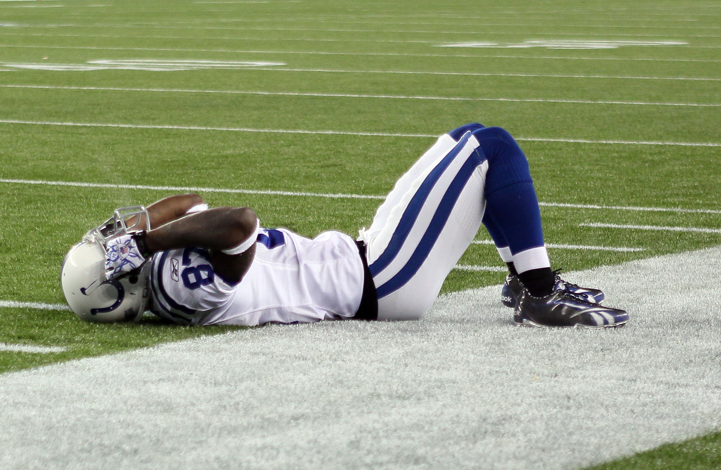 FOXBORO, MA - NOVEMBER 21:  Reggie Wayne #87 of the Indianapolis Colts reacts after he dropped a pass in the fourth quarter against the New England Patriots on November 21, 2010 at Gillette Stadium in Foxboro, Massachusetts. The Patriots defeated the Colt