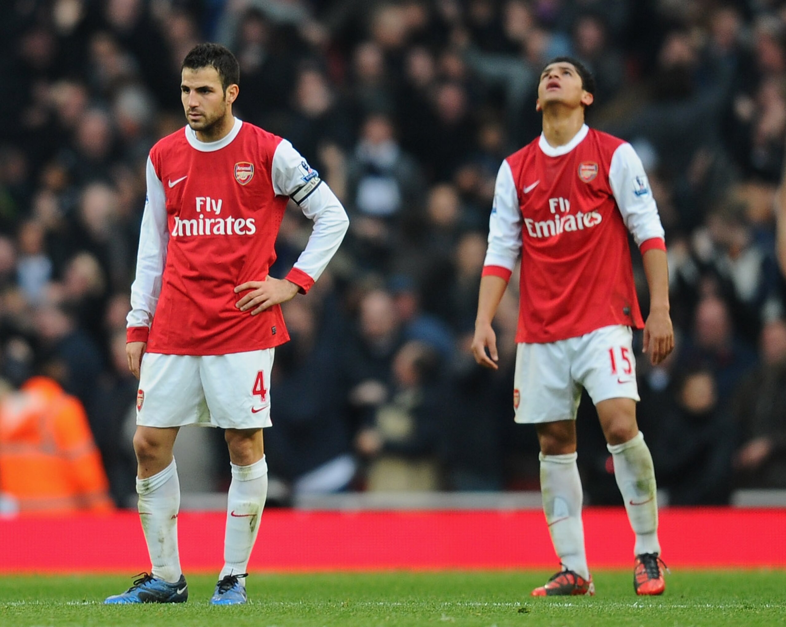LONDON, ENGLAND - NOVEMBER 20:  Cesc Fabregas and Denilson of Arsenal react to Tottenham's winning goal during the Barclays Premier League match between Arsenal and Tottenham Hotspur at the Emirates Stadium on November 20, 2010 in London, England.  (Photo