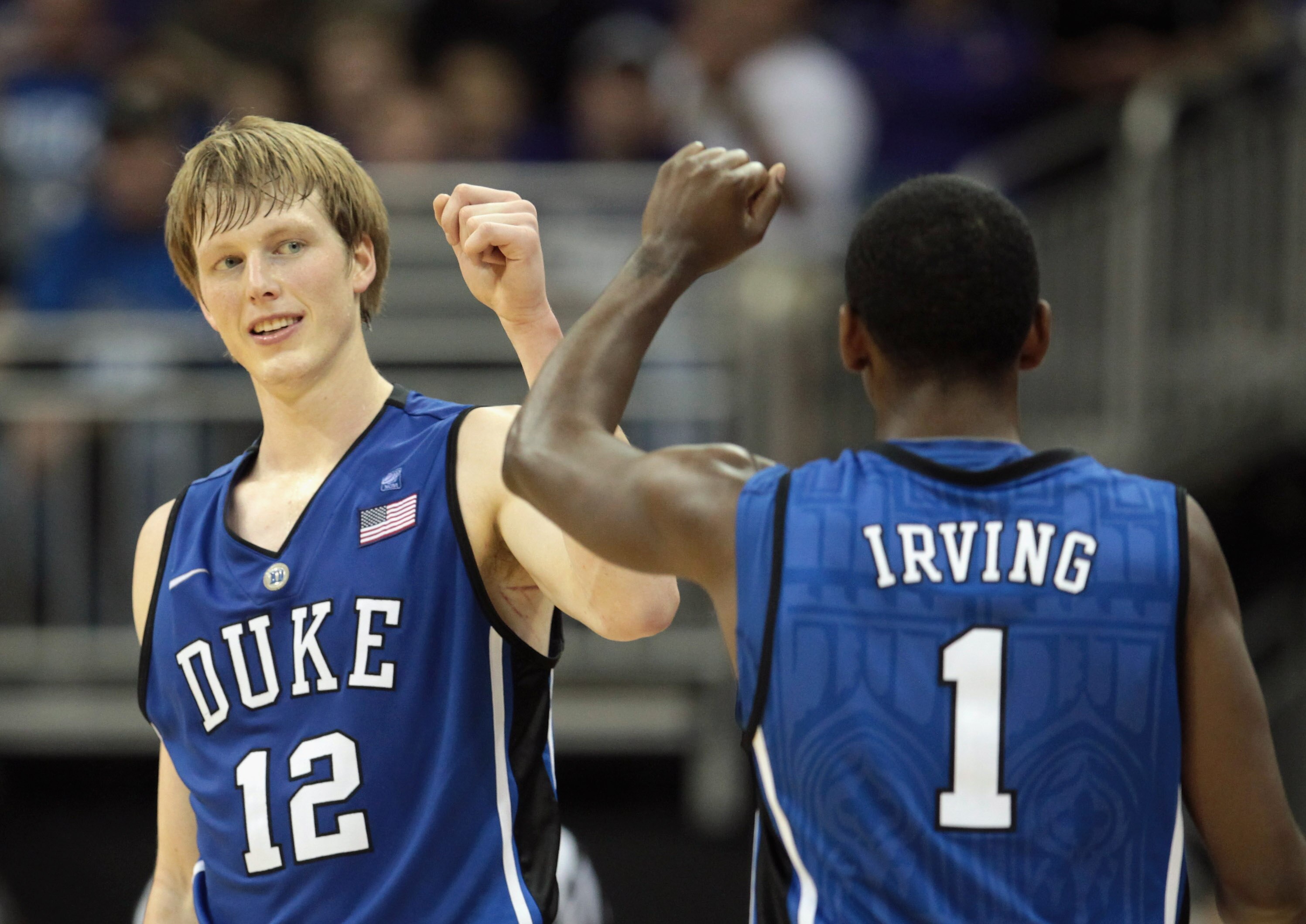 KANSAS CITY, MO - NOVEMBER 23:  Kyle Singler #12 of the Duke Blue Devils is congratulated by Kyrie Irving #1 after scoring during the CBE Classic championship game on November 23, 2010 at the Sprint Center in Kansas City, Missouri.  (Photo by Jamie Squire