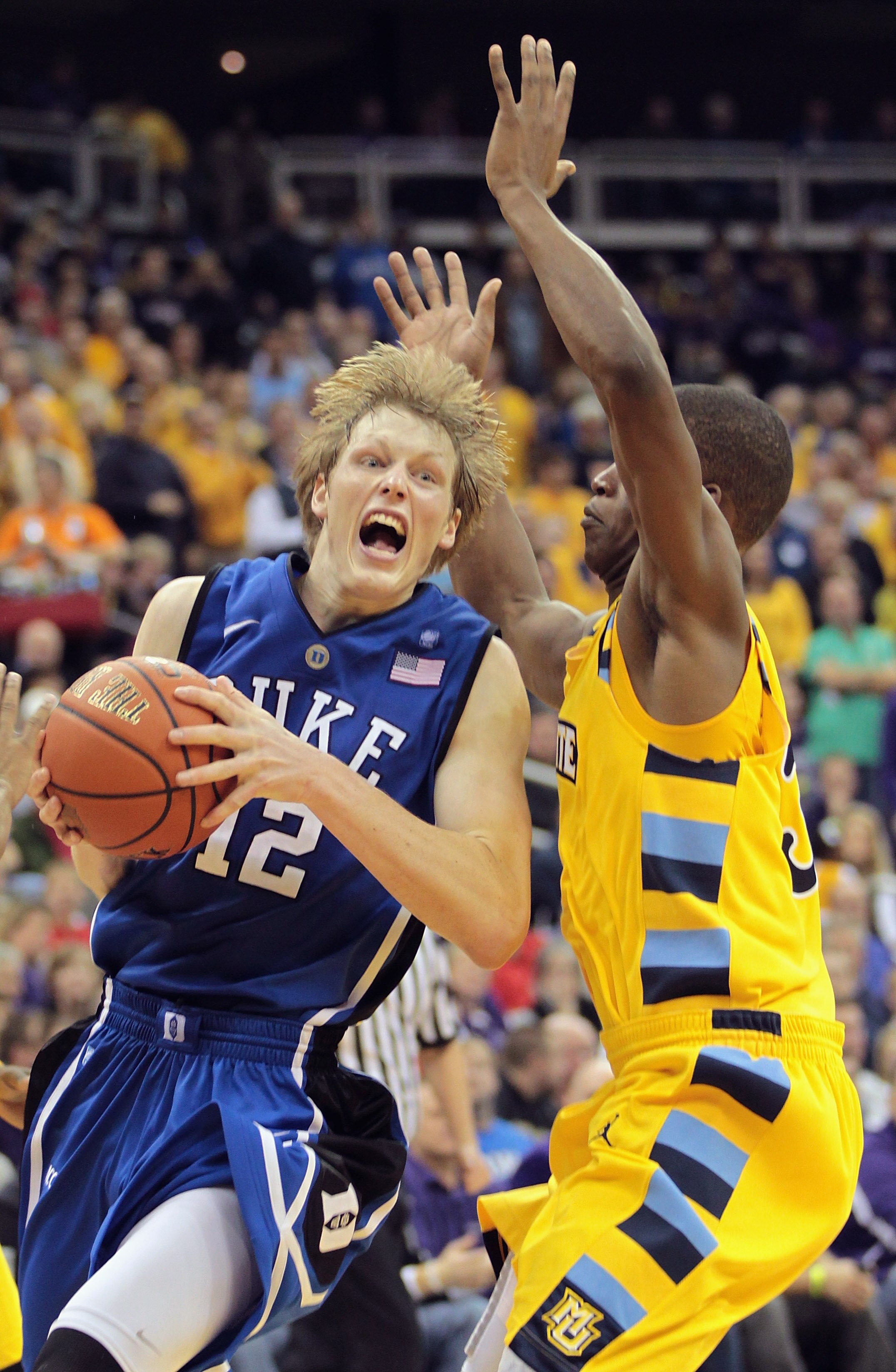 KANSAS CITY, MO - NOVEMBER 22:  Kyle Singler #12 of the Duke Blue Devils drives during the CBE Classic game against the Marquette Golden Eagles on November 22, 2010 at the Sprint Center in Kansas City, Missouri.  (Photo by Jamie Squire/Getty Images)