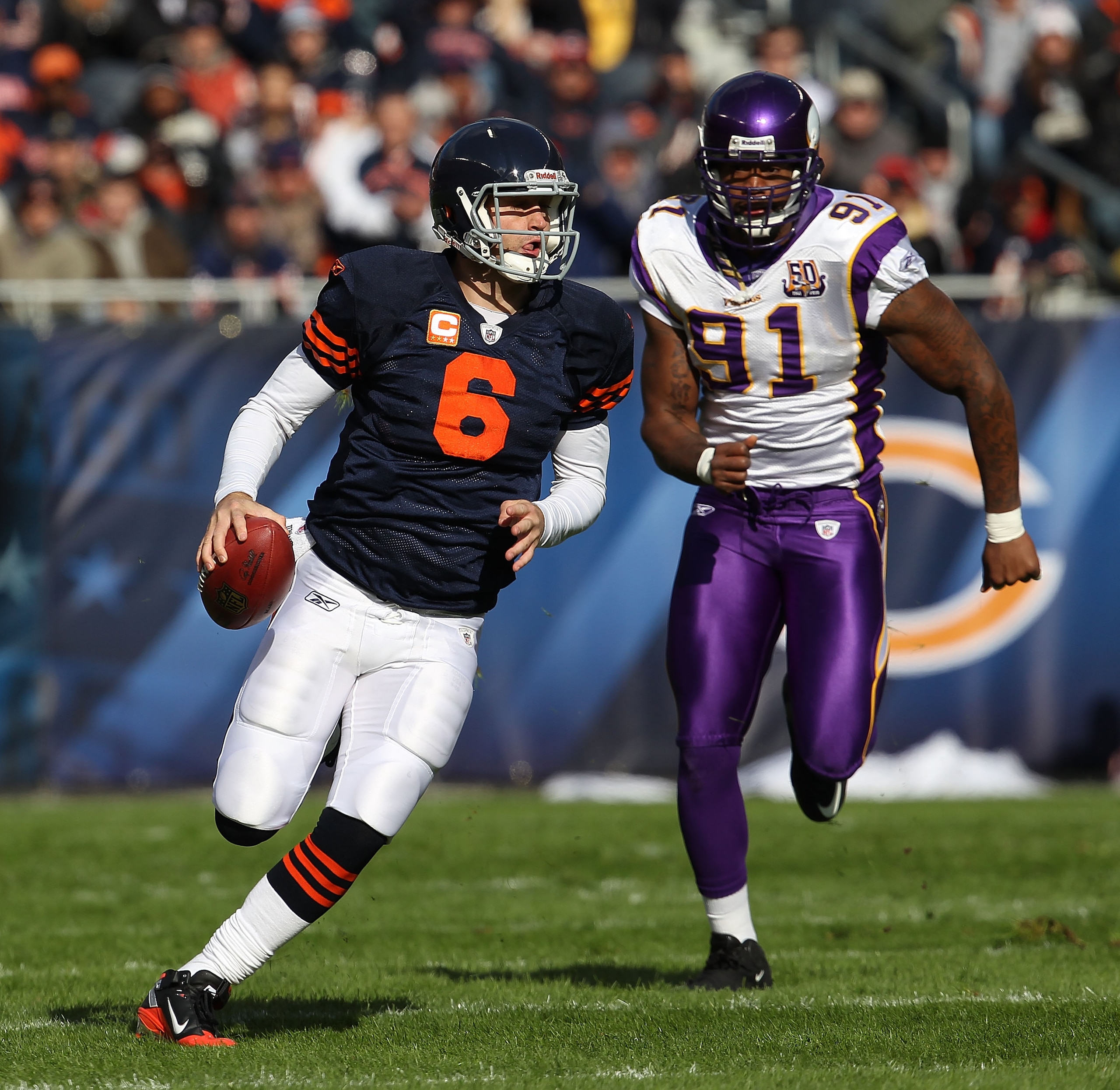 CHICAGO - NOVEMBER 14: Jay Cutler #6 of the Chicago Bears runs for a first down as Ray Edwards #91 of the Minnesota Vikings gives chase at Soldier Field on November 14, 2010 in Chicago, Illinois. The Bears defeated the Vikings 27-13. (Photo by Jonathan Da