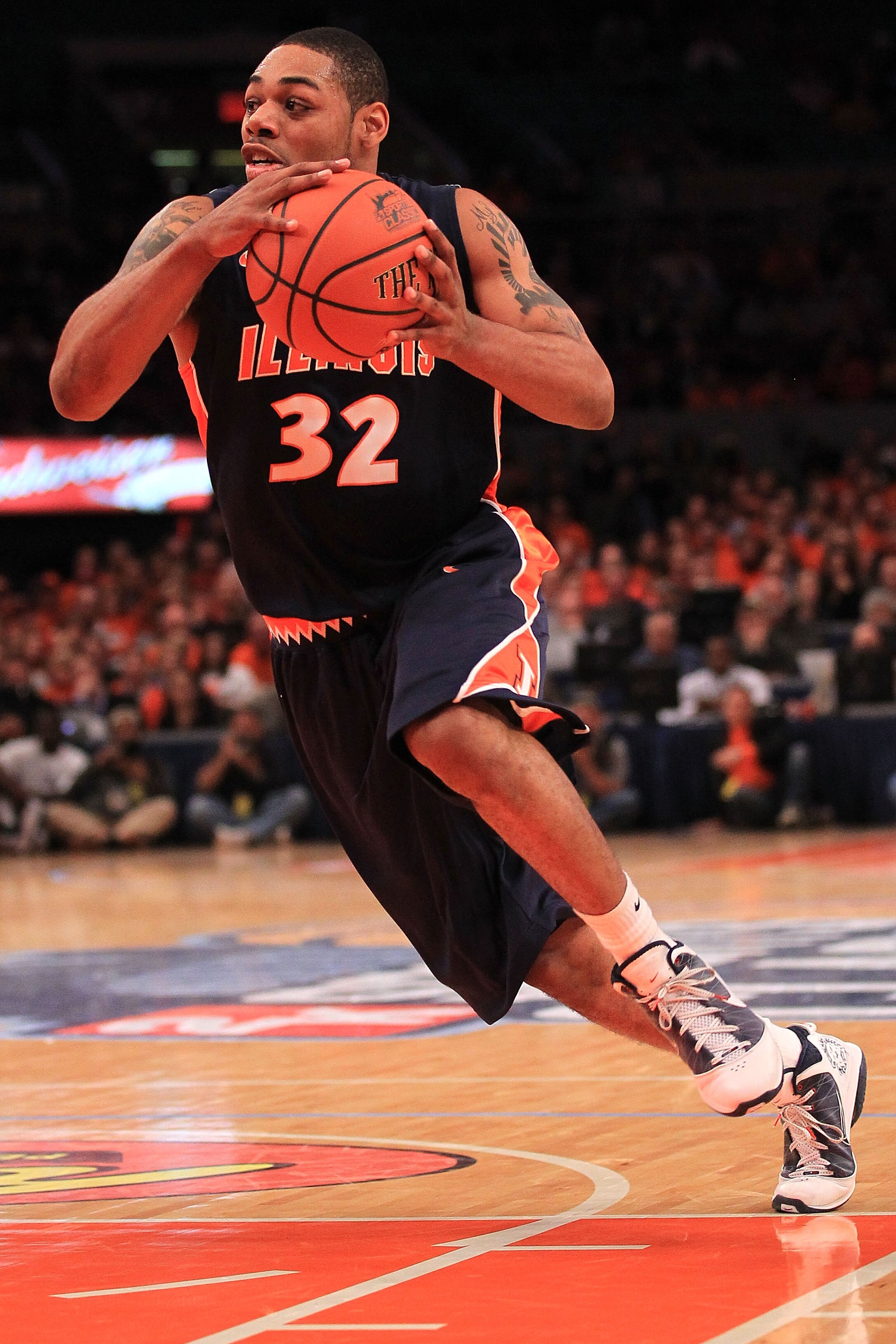 NEW YORK - NOVEMBER 18:  Demetri McCamey #32 of the Illinois Fighting Illini drives to the basket against the Texas Longhorns during the 2k Sports Classic at Madison Square Garden on November 18, 2010 in New York, New York.  (Photo by Chris McGrath/Getty