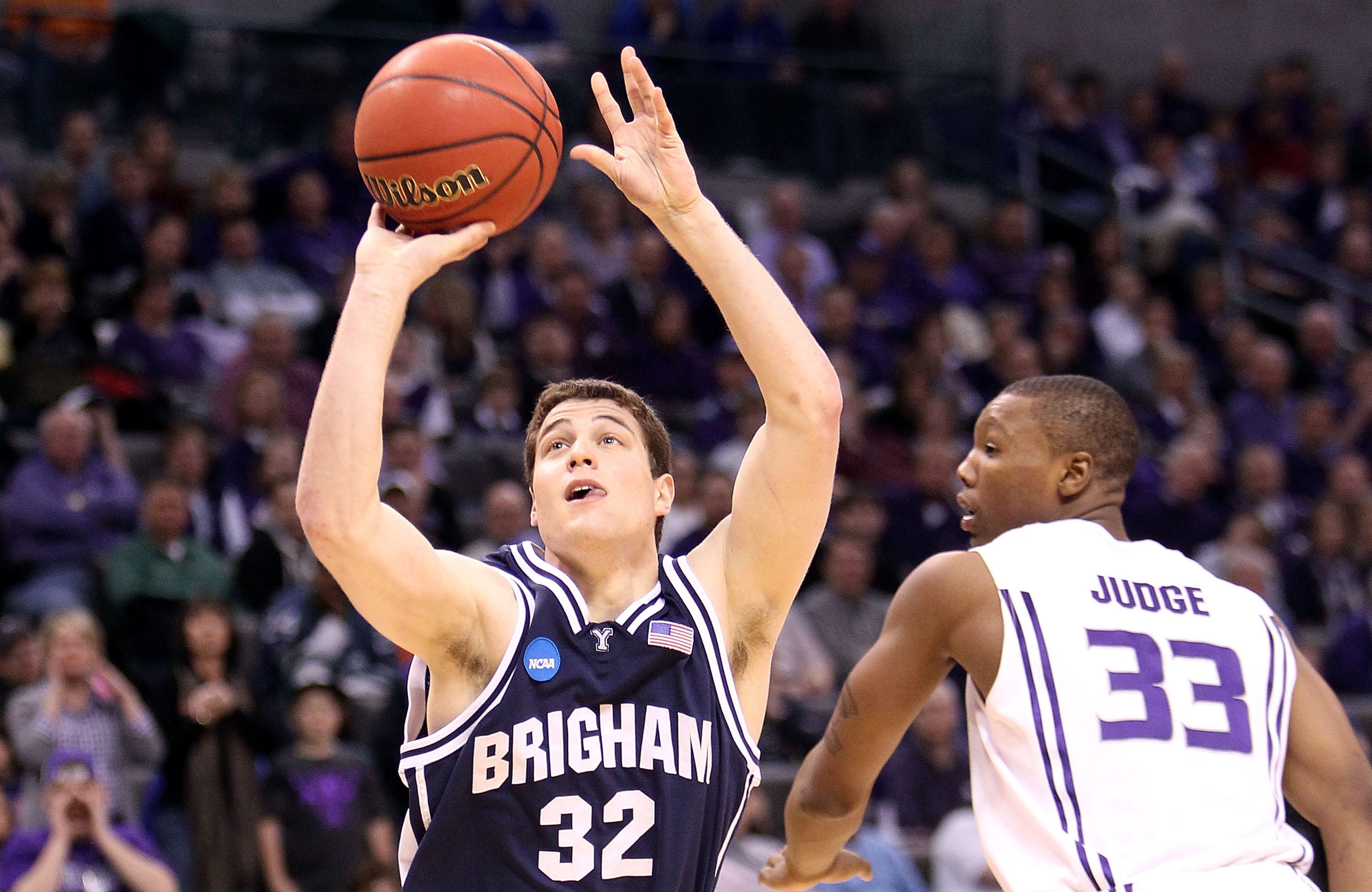OKLAHOMA CITY - MARCH 20:  Jimmer Fredette #32 of the Brigham Young Cougars attempts a shot against Wally Judge #33 of the Kansas State Wildcats during the second round of the 2010 NCAA men's basketball tournament at Ford Center on March 20, 2010 in Oklah