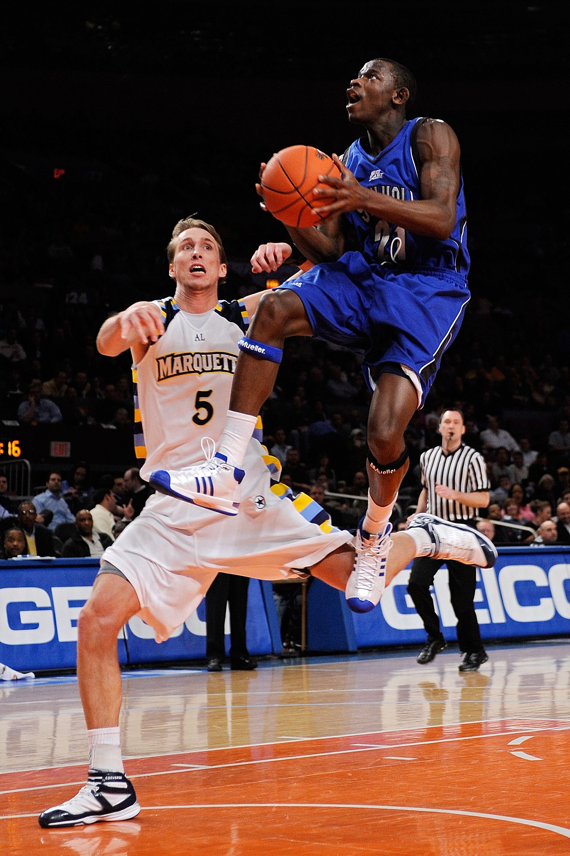 NEW YORK - MARCH 12:  Jeremy Hazell #21 of the Seton Hall Pirates gets the basket and the foul against Dan Fitzgerald #5 of the Marquette Golden Eagles during the 2008 Big East Men's Basketball Championship at Madison Square Garden on March 12, 2008 in Ne
