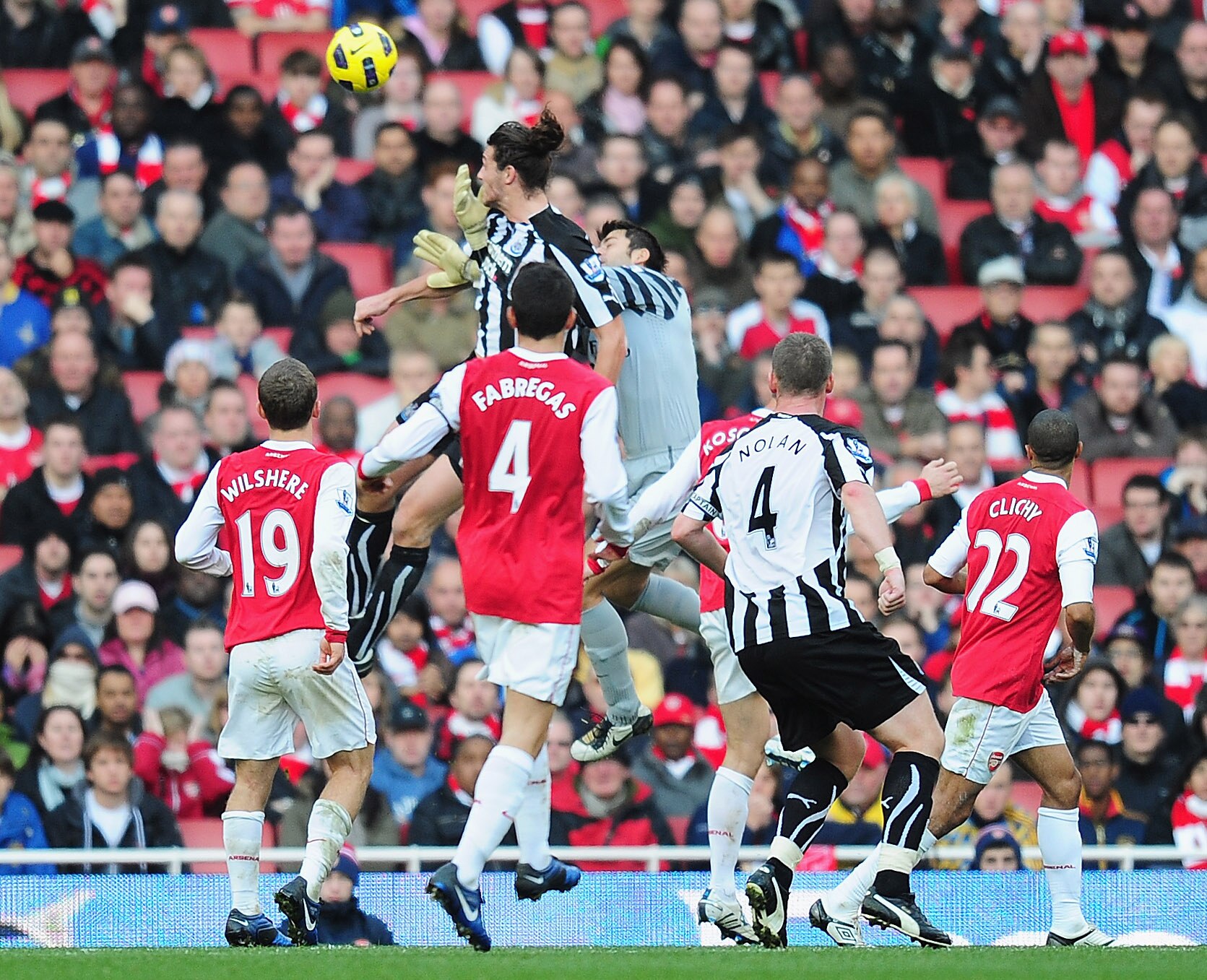 LONDON, ENGLAND - NOVEMBER 07:  Andy Carroll of Newcastle gets above Lukasz Fabianski of Arsenal to score during the Barclays Premier League match between Arsenal and Newcastle United at the Emirates Stadium on November 7, 2010 in London, England.  (Photo