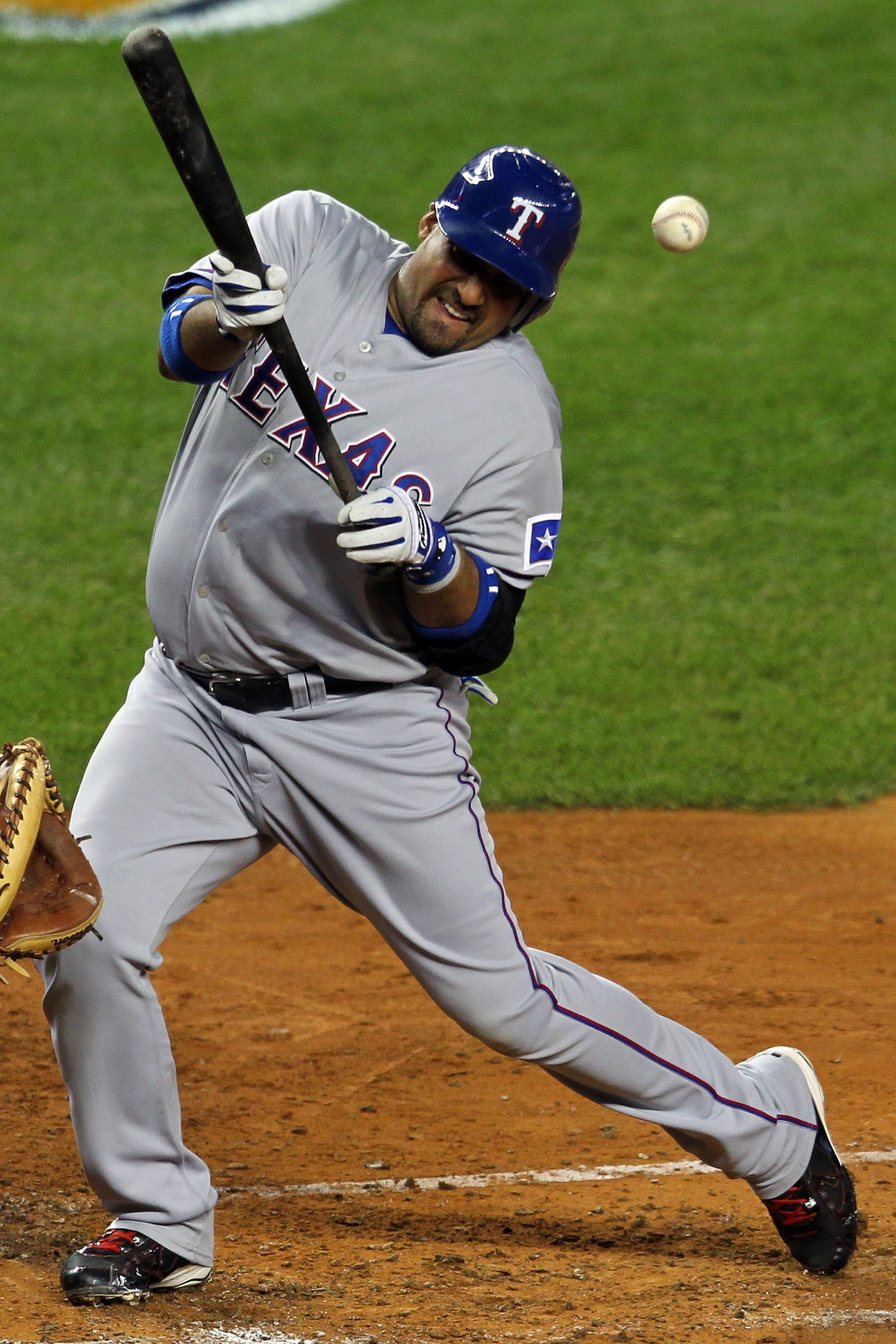 NEW YORK - OCTOBER 19: Bengie Molina #11 of the Texas Rangers gets hit by a pitch against the New York Yankees in Game Four of the ALCS during the 2010 MLB Playoffs at Yankee Stadium on October 19, 2010 in the Bronx borough of New York City. (Photo by N NEW YORK - OCTOBER 19: Bengie Molina #11 of the Texas Rangers gets hit by a pitch against the New York Yankees in Game Four of the ALCS during the 2010 MLB Playoffs at Yankee Stadium on October 19, 2010 in the Bronx borough of New York City. (Photo by N