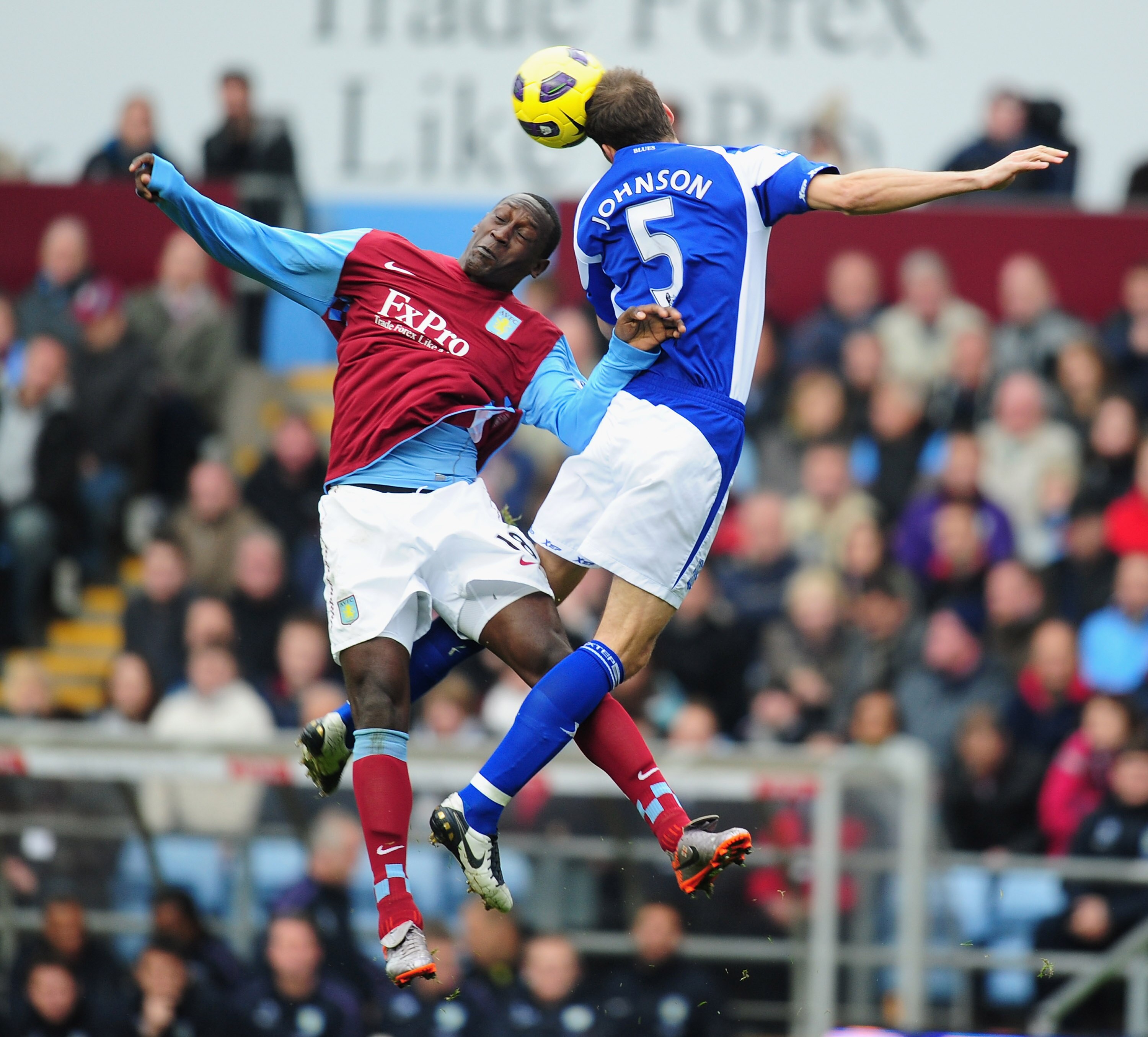 BIRMINGHAM, ENGLAND - OCTOBER 31:  Emile Heskey of Aston Villa is challenged by Roger Johnson of Birmingham during the Barclays Premier League match between Aston Villa and Birmingham at Villa Park on October 31, 2010 in London, England.  (Photo by Mike H
