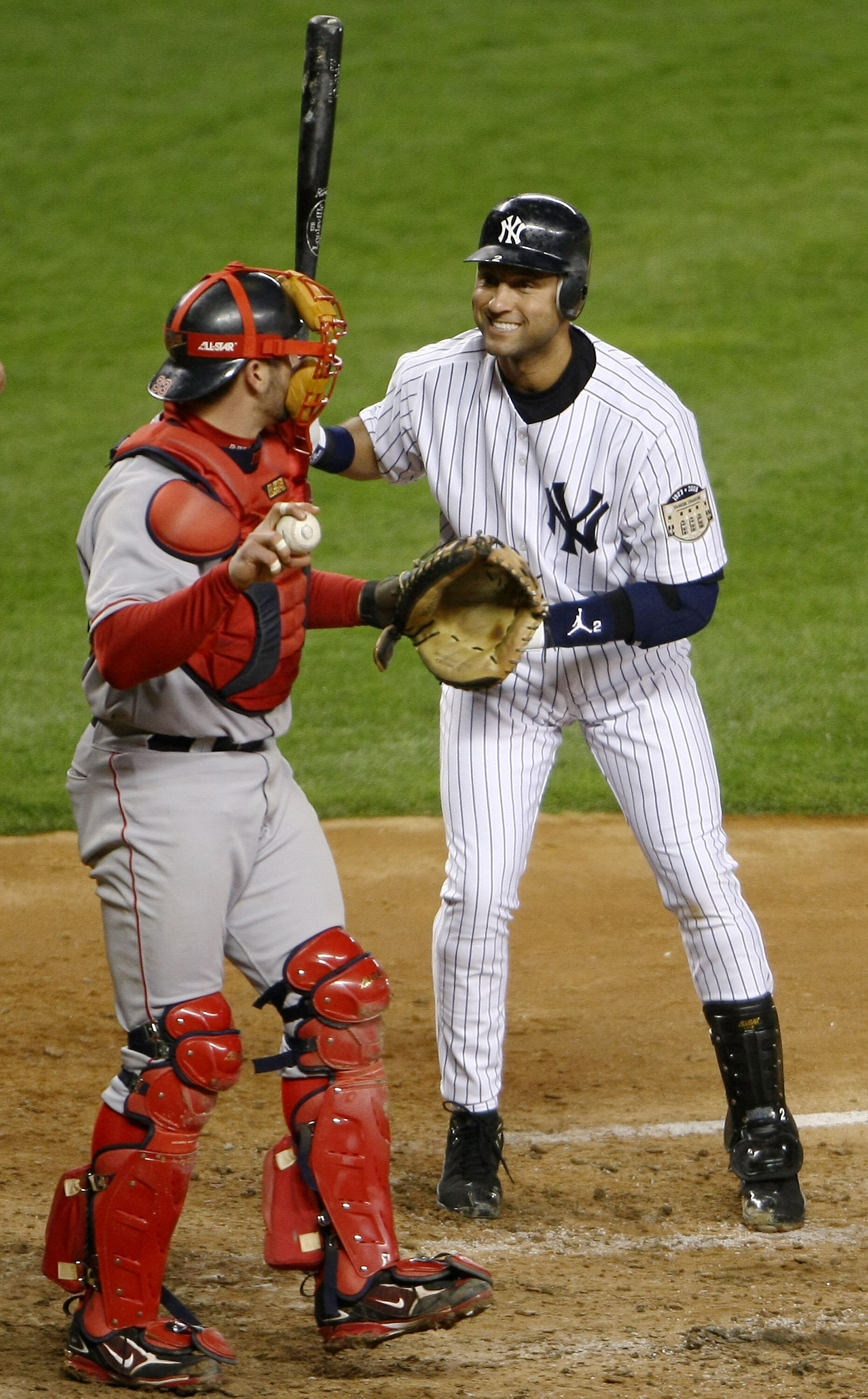 NEW YORK - APRIL 16: Derek Jeter #2 of the New York Yankees reacts to Jason Varitek #33 of the Boston Red Sox after having a strike called during their game on April 16, 2008 at Yankee Stadium in the Bronx borough of New York City.  (Photo by Chris McGrat