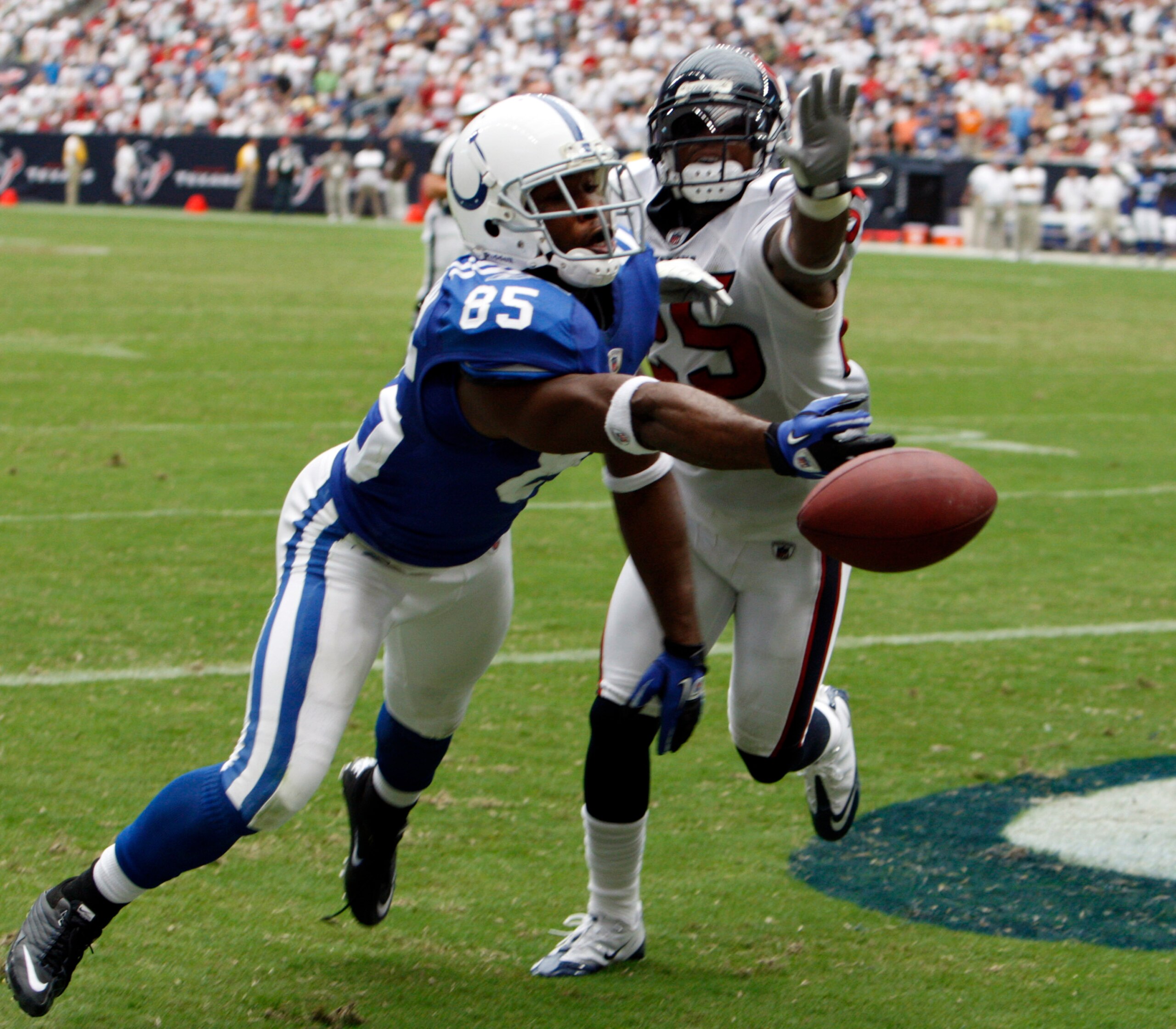 HOUSTON - SEPTEMBER 12:  Wide receiver Pierre Garcon #85 of the Indianapolis Colts can't come up with the catch as cornerback Kareem Jackson #25 of the Houston Texans defends on the play during the NFL season opener at Reliant Stadium on September 12, 201