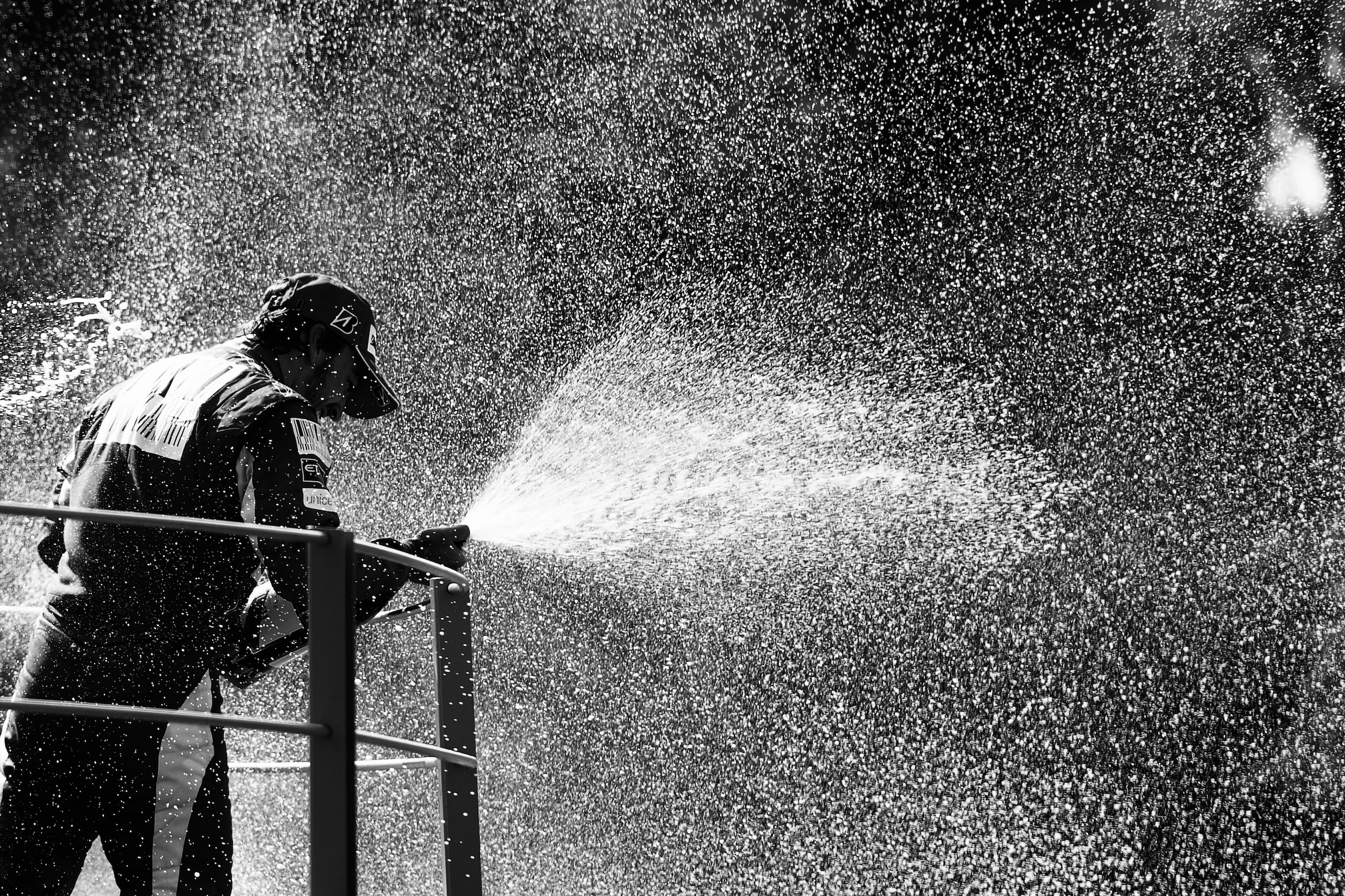 MONZA, ITALY - SEPTEMBER 12: (EDITORS NOTE: THIS BLACK AND WHITE IMAGE WAS CREATED FROM ORIGINAL COLOUR FILE) Fernando Alonso of Spain and Ferrari celebrates on the podium after winning the Italian Formula One Grand Prix at the Autodromo Nazionale di Mon MONZA, ITALY - SEPTEMBER 12: (EDITORS NOTE: THIS BLACK AND WHITE IMAGE WAS CREATED FROM ORIGINAL COLOUR FILE) Fernando Alonso of Spain and Ferrari celebrates on the podium after winning the Italian Formula One Grand Prix at the Autodromo Nazionale di Mon