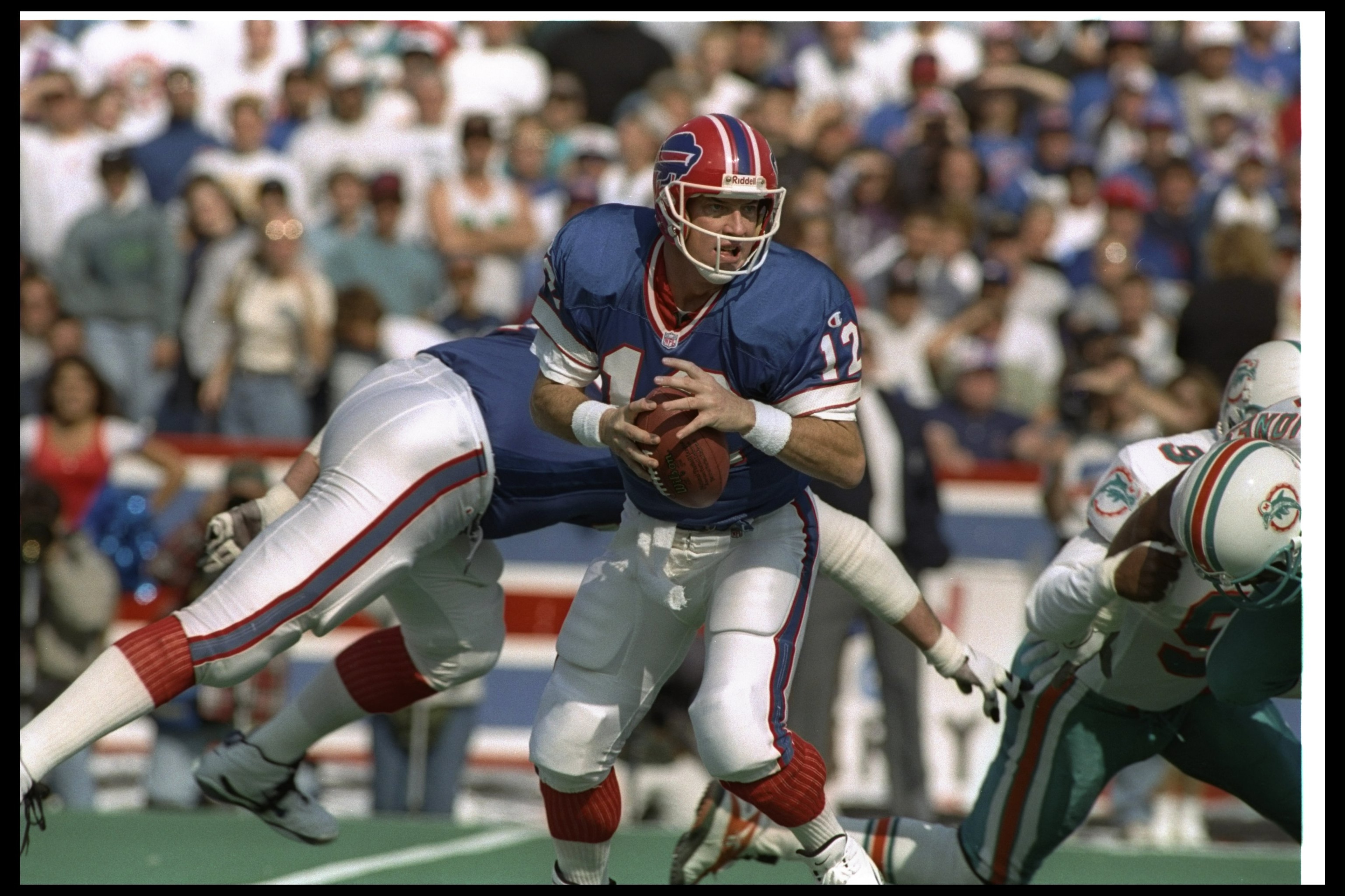 13 Oct 1996:  Quarterback Jim Kelly of the Buffalo Bills prepares to hand off the ball during a game against the Miami Dolphins at Rich Stadium in Orchard Park, New York.  The Dolphins won the game, 21-7. Mandatory Credit: Rick Stewart/Allsport