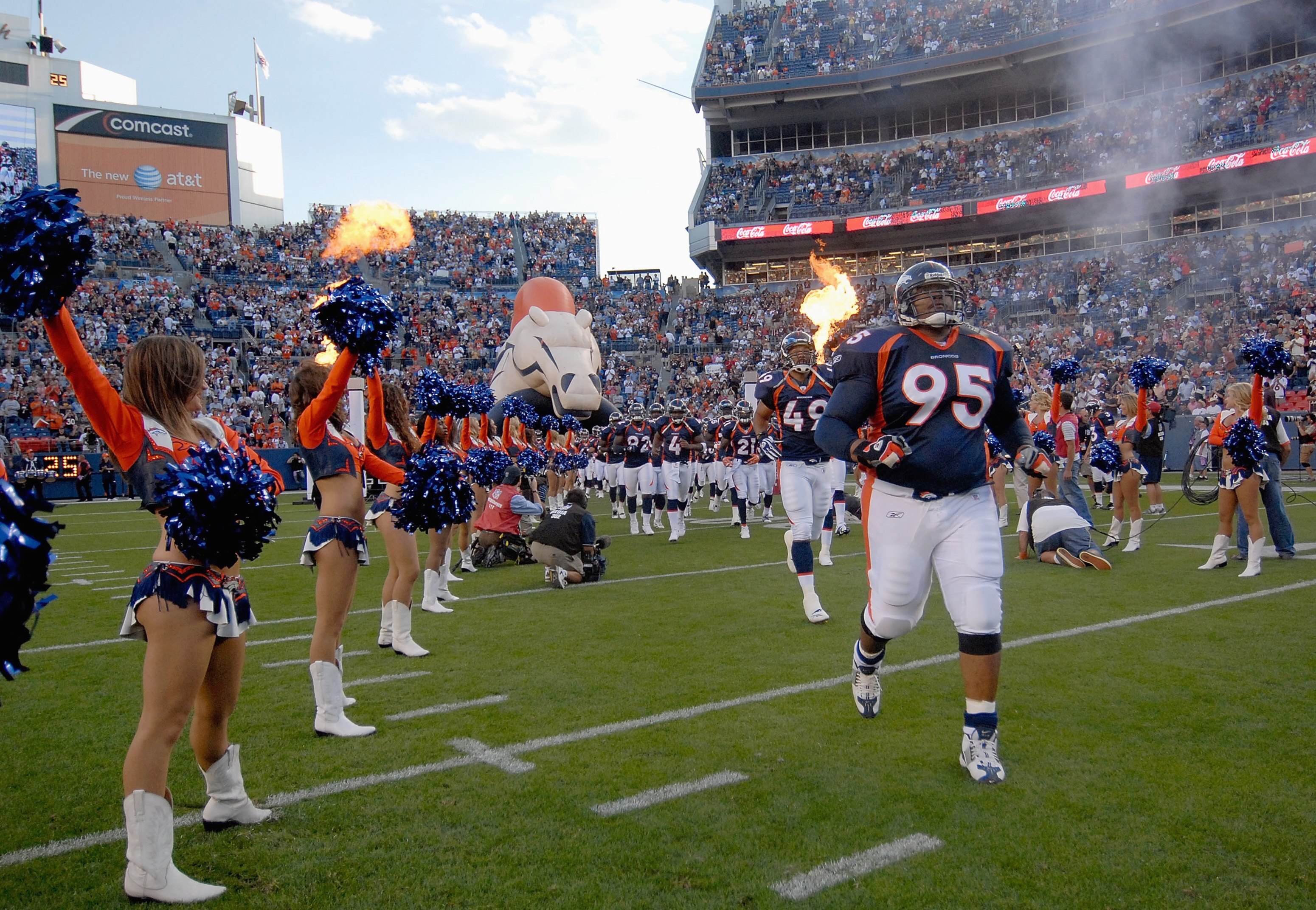 DENVER - AUGUST 25: Defensive tackle Sam Adams #95 of the Denver Broncos runs out with the the team before the pre-season football game against the Cleveland Browns on August 25, 2006 at Invesco Field at Mile High in Denver, Colorado.  (Photo by Steve Dyk