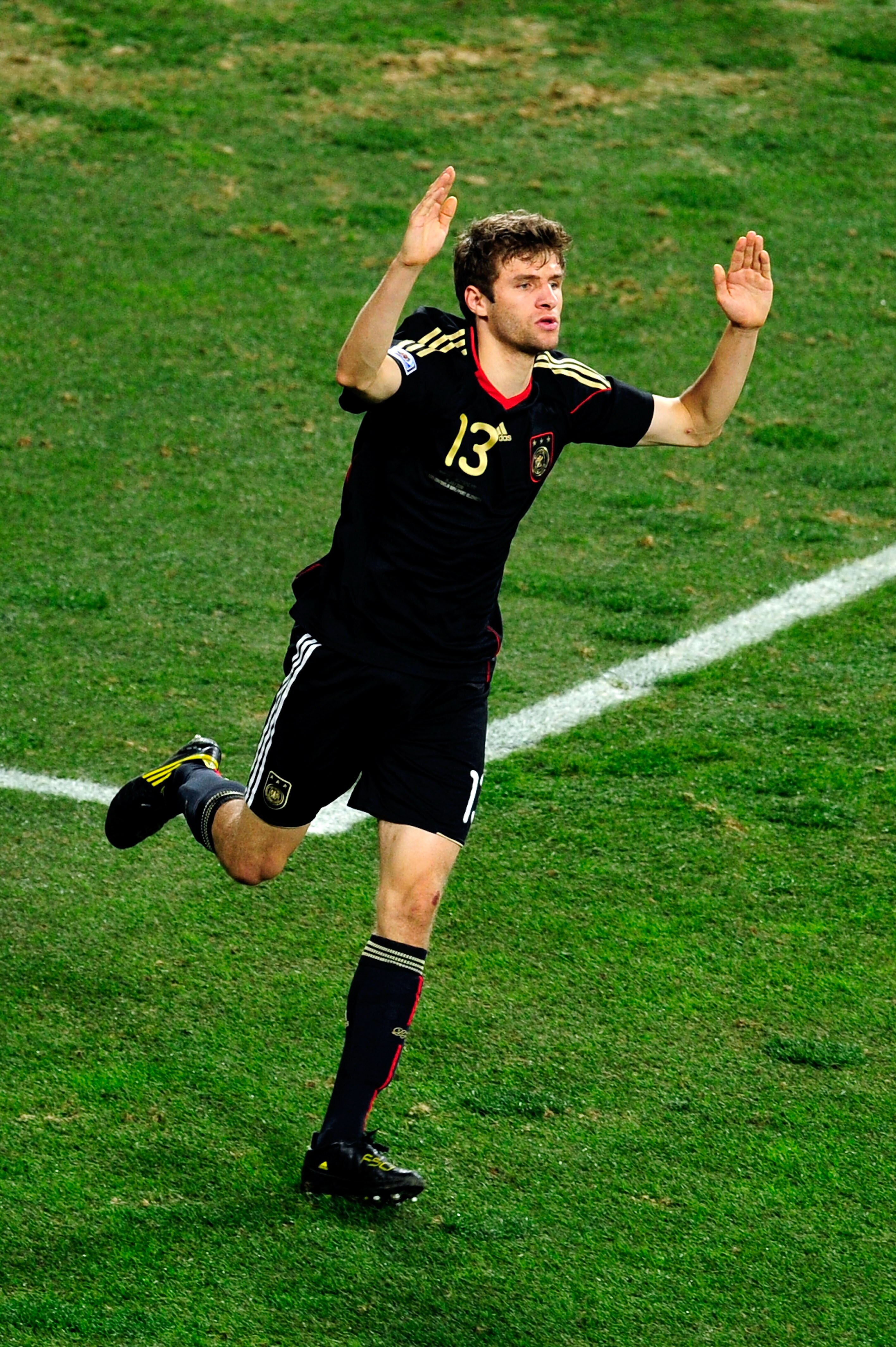 PORT ELIZABETH, SOUTH AFRICA - JULY 10:  Thomas Mueller of Germany celebrates scoring the opening goal during the 2010 FIFA World Cup South Africa Third Place Play-off match between Uruguay and Germany at The Nelson Mandela Bay Stadium on July 10, 2010 in
