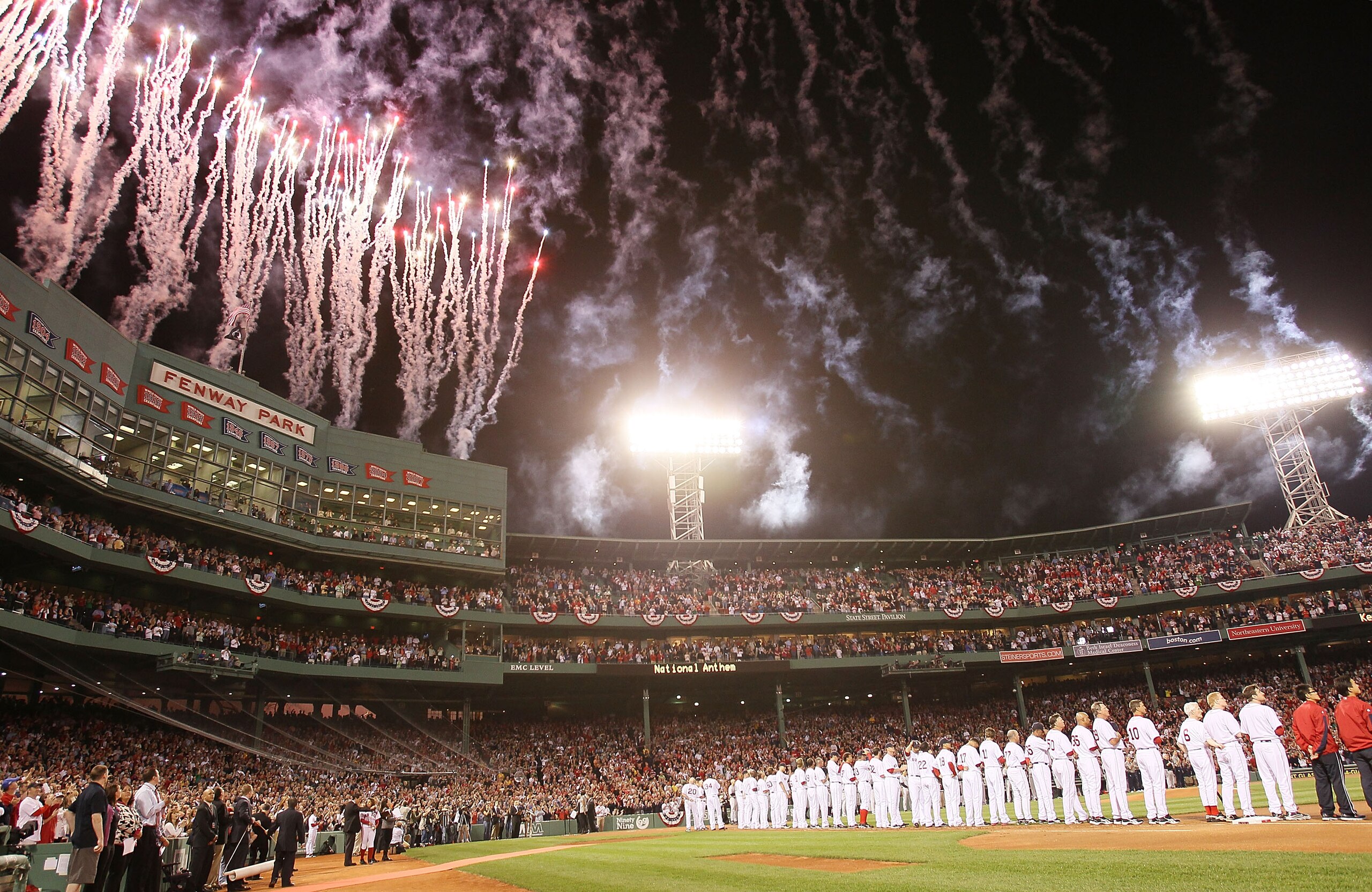 BOSTON - APRIL 04:  Fireworks go off during the national anthem before the the Boston Red Sox take on the New York Yankees on April 4, 2010 during Opening Night at Fenway Park in Boston, Massachusetts.  (Photo by Elsa/Getty Images)