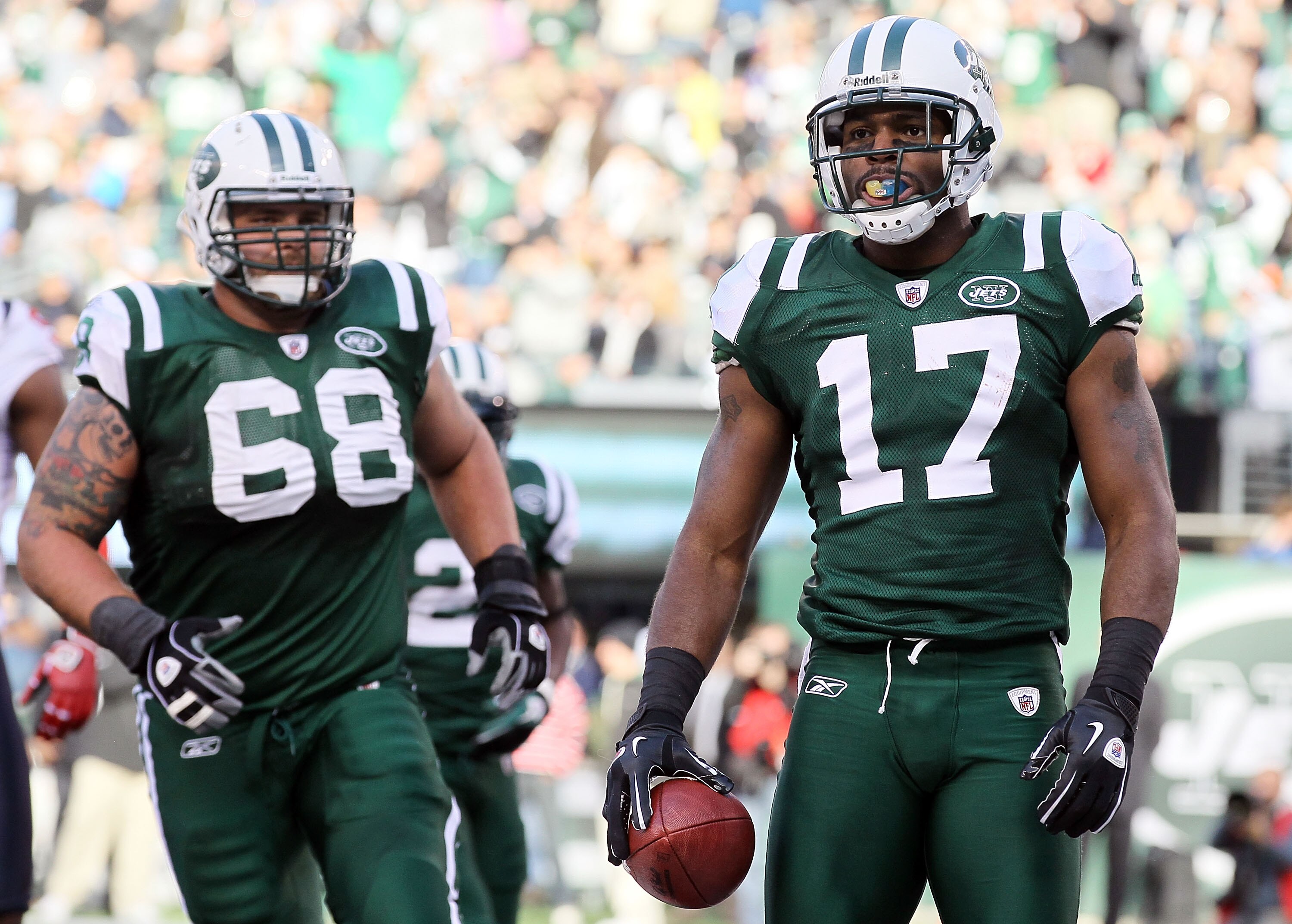 EAST RUTHERFORD, NJ - NOVEMBER 21: Braylon Edwards #17 of the New York Jets looks on after scoring a touchdown agianst the Houston Texans as teammate Matt Saluson #68 looks on November 21, 2010 at the New Meadowlands Stadium in East Rutherford, New Jersey