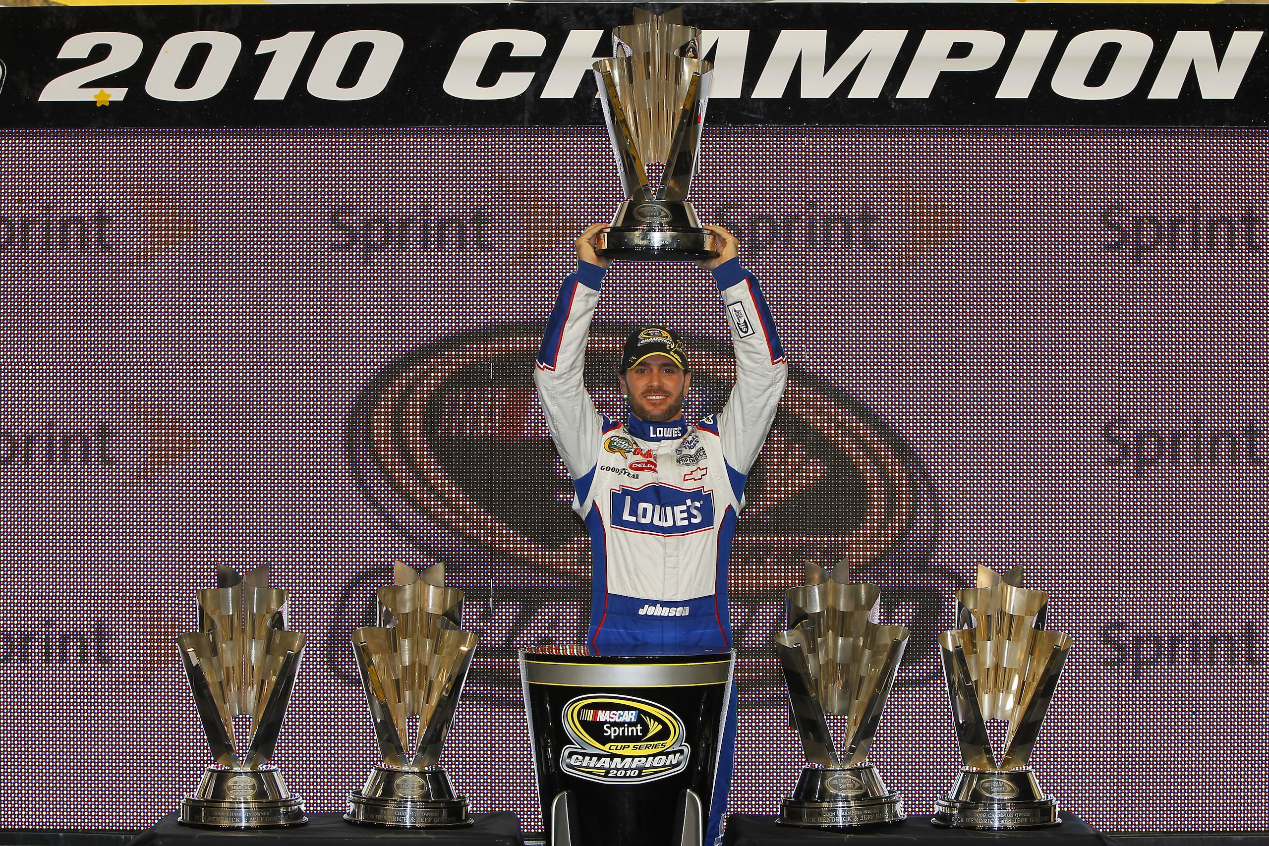 HOMESTEAD, FL - NOVEMBER 21: Jimmie Johnson, driver of the #48 Lowe's Chevrolet, celebrates after finishing in second place in the Ford 400 to clinch his fifth consecutive NASCAR Sprint Cup championship at Homestead-Miami Speedway on November 21, 2010 in HOMESTEAD, FL - NOVEMBER 21: Jimmie Johnson, driver of the #48 Lowe's Chevrolet, celebrates after finishing in second place in the Ford 400 to clinch his fifth consecutive NASCAR Sprint Cup championship at Homestead-Miami Speedway on November 21, 2010 in