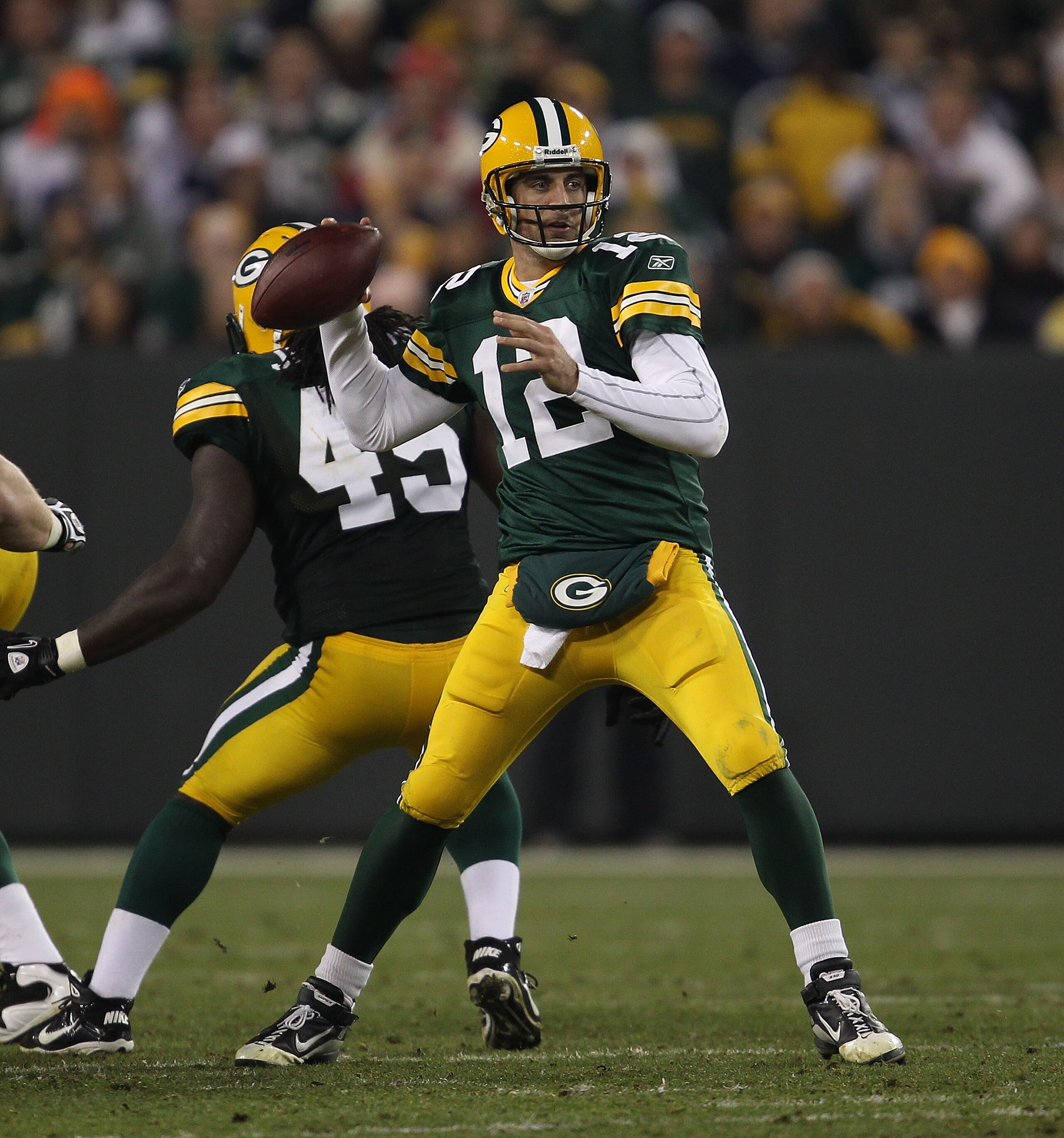 GREEN BAY, WI - NOVEMBER 07: Aaron Rodgers #12 of the Green Bay Packers throws a pass against the Dallas Cowboys at Lambeau Field on November 7, 2010 in Green Bay, Wisconsin. The Packers defeated the Cowboys 45-7. (Photo by Jonathan Daniel/Getty Images)