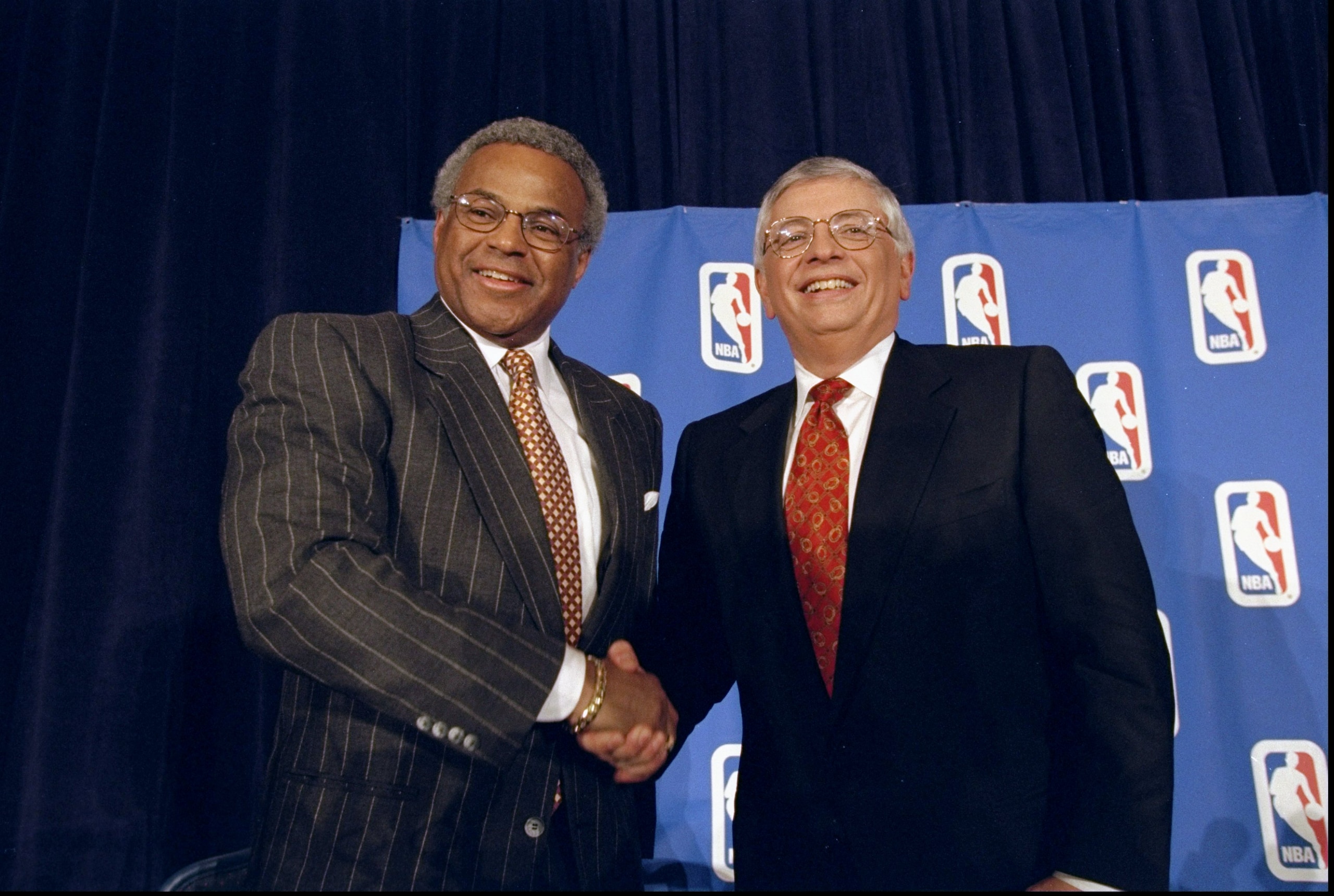 7 Jan 1999:  NBA Union Director Billy Hunter (L) shakes hands with NBA Commissioner David Stern (R) at the NBA Lockout Ending press conference at the New York Sheraton in New York, New York. Mandatory Credit: Ezra O. Shaw  /Allsport