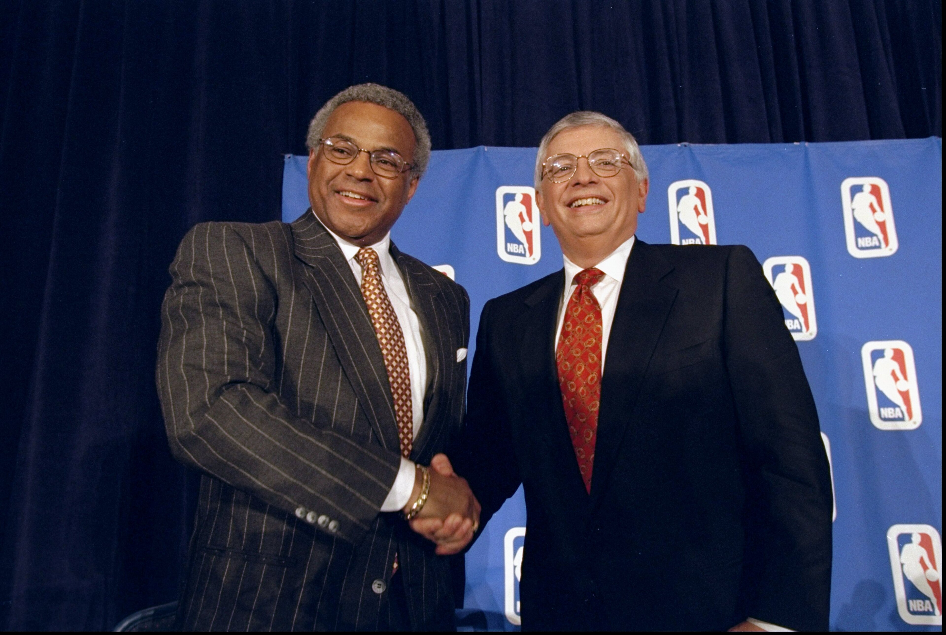 7 Jan 1999:  NBA Union Director Billy Hunter (L) shakes hands with NBA Commissioner David Stern (R) at the NBA Lockout Ending press conference at the New York Sheraton in New York, New York. Mandatory Credit: Ezra O. Shaw  /Allsport