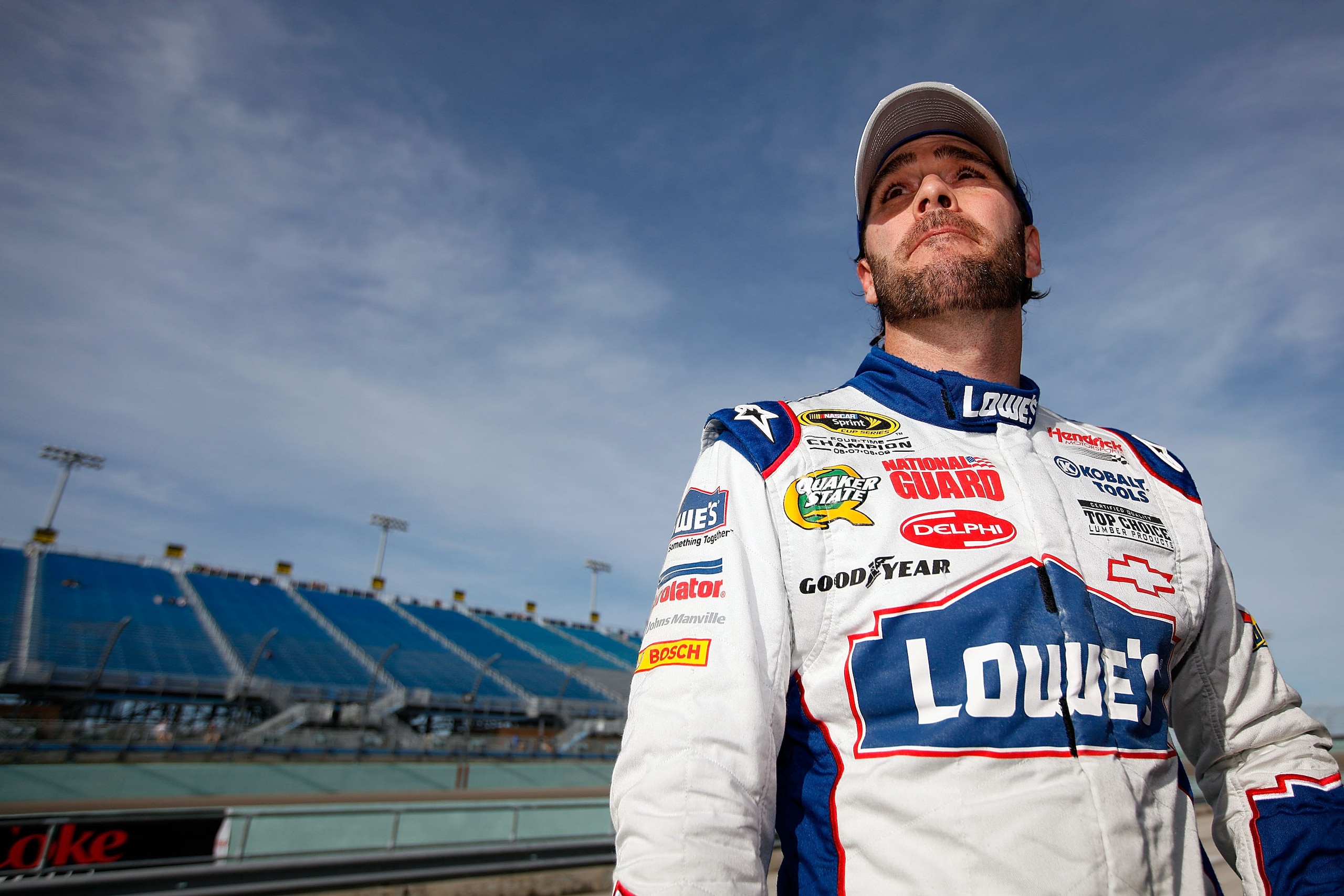 HOMESTEAD, FL - NOVEMBER 19: Jimmie Johnson, driver of the #48 Lowe's Chevrolet, stands on the grid after qualifying for the NASCAR Sprint Cup Series Ford 400 at Homestead-Miami Speedway on November 19, 2010 in Homestead, Florida. (Photo by Chris Grayth HOMESTEAD, FL - NOVEMBER 19: Jimmie Johnson, driver of the #48 Lowe's Chevrolet, stands on the grid after qualifying for the NASCAR Sprint Cup Series Ford 400 at Homestead-Miami Speedway on November 19, 2010 in Homestead, Florida. (Photo by Chris Grayth