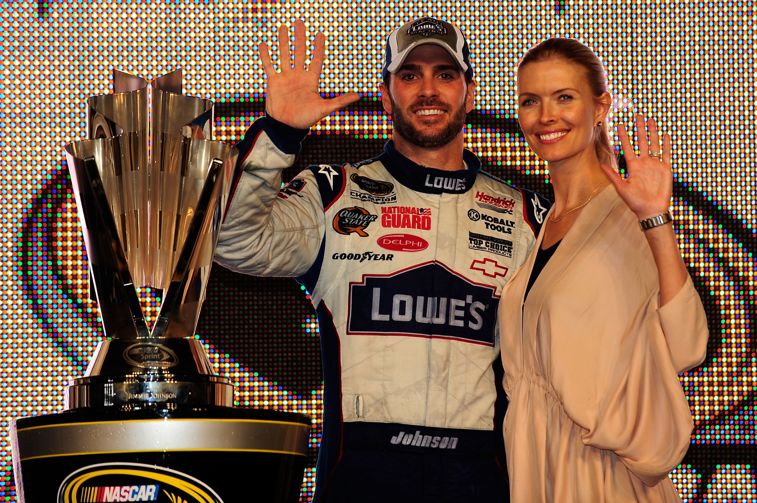 HOMESTEAD, FL - NOVEMBER 21: Jimmie Johnson (L), driver of the #48 Lowe's Chevrolet, poses with his wife Chandra after finishing in second place in the Ford 400 to clinch his fifth consecutive NASCAR Sprint Cup championship at Homestead-Miami Speedway on HOMESTEAD, FL - NOVEMBER 21: Jimmie Johnson (L), driver of the #48 Lowe's Chevrolet, poses with his wife Chandra after finishing in second place in the Ford 400 to clinch his fifth consecutive NASCAR Sprint Cup championship at Homestead-Miami Speedway on