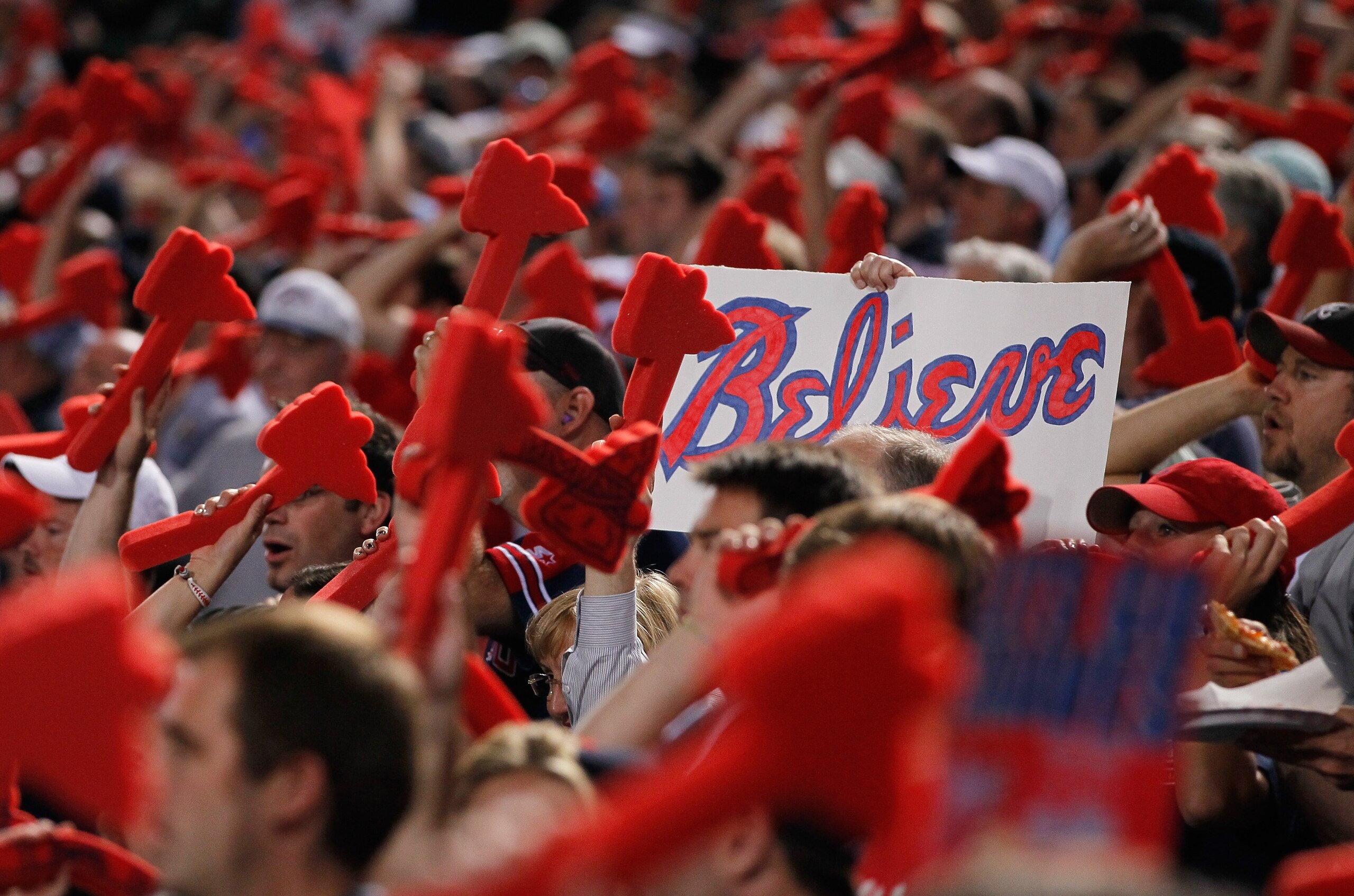 ATLANTA - OCTOBER 11:  Fans of the Atlanta Braves cheer before the beginning of the game against the San Francisco Giants during Game Four of the NLDS of the 2010 MLB Playoffs at Turner Field on October 11, 2010 in Atlanta, Georgia.  (Photo by Kevin C. Co