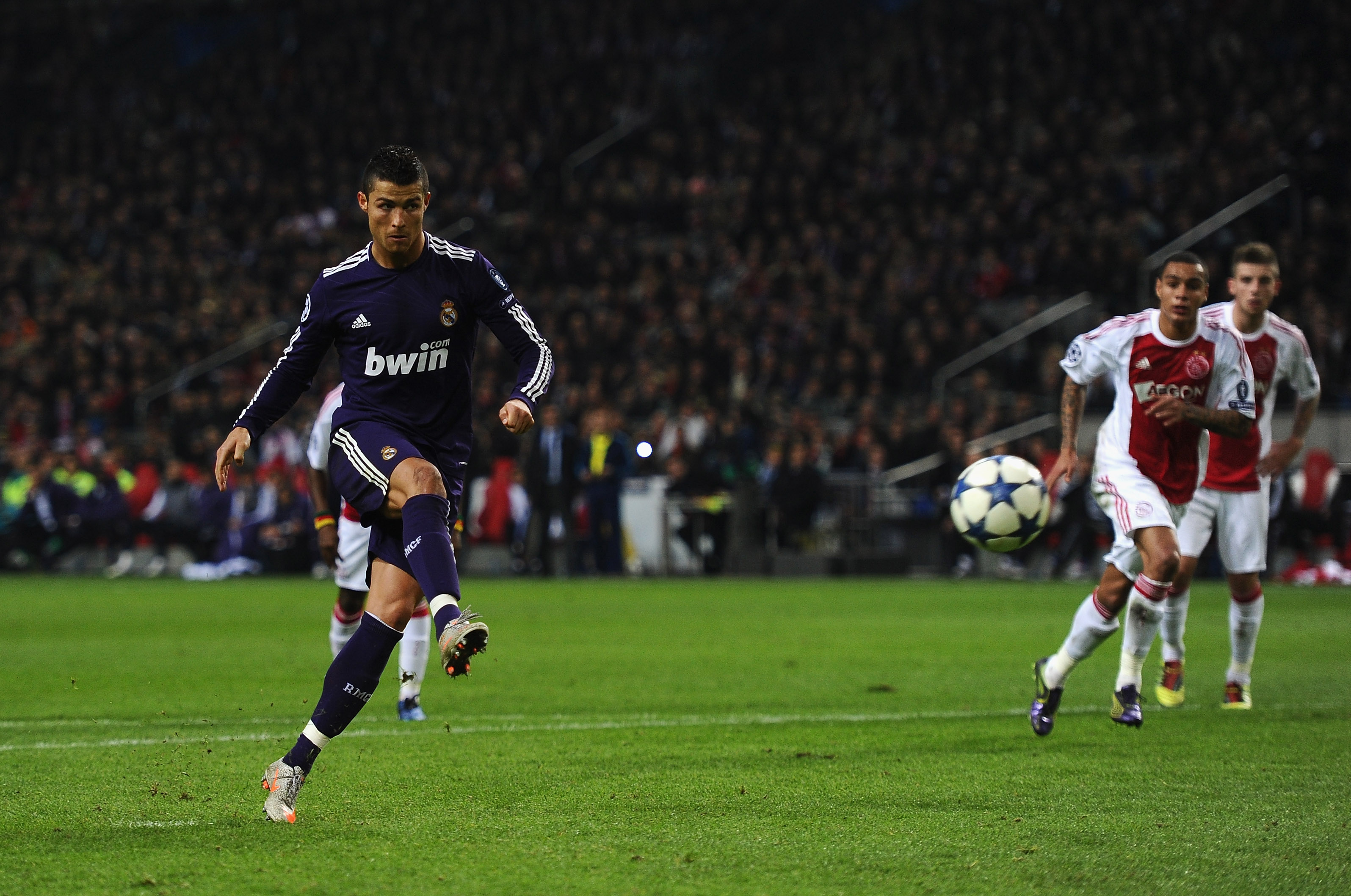 AMSTERDAM, NETHERLANDS - NOVEMBER 23: Cristiano Ronaldo of Real Madrid scores the fourth goal from the penalty spot during the UEFA Champions League Group G match between AFC Ajax and Real Madrid at the Ajax Arena on November 23, 2010 in Amsterdam, Nethe AMSTERDAM, NETHERLANDS - NOVEMBER 23: Cristiano Ronaldo of Real Madrid scores the fourth goal from the penalty spot during the UEFA Champions League Group G match between AFC Ajax and Real Madrid at the Ajax Arena on November 23, 2010 in Amsterdam, Nethe