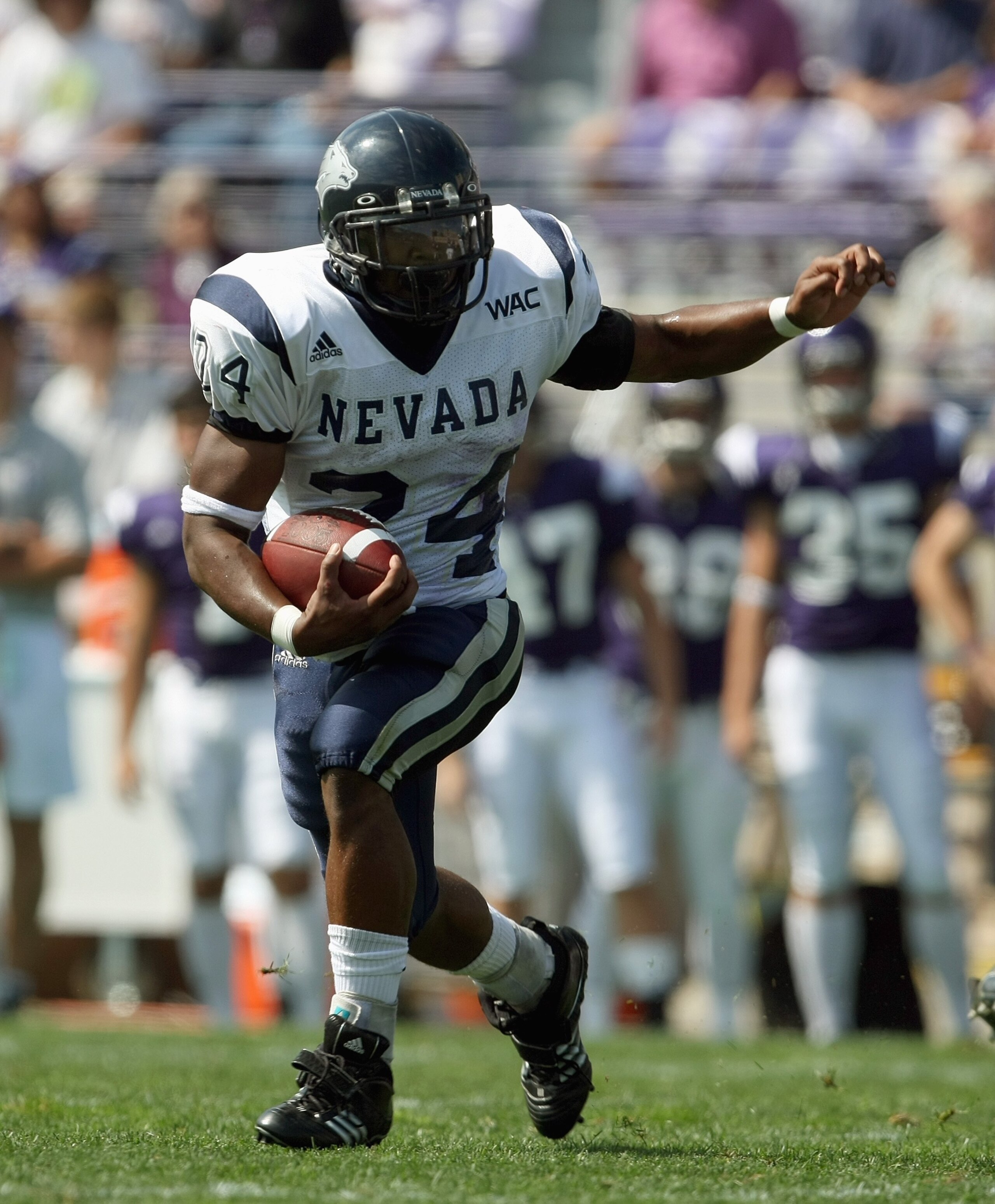 EVANSTON, IL - SEPTEMBER 8:  Brandon Fragger #24 of the Nevada Wolf Pack carries the ball against the Northwestern Wildcats on September 8, 2007 at Ryan Field at Northwestern University in Evanston, Illinois. (Photo by Jonathan Daniel/Getty Images)