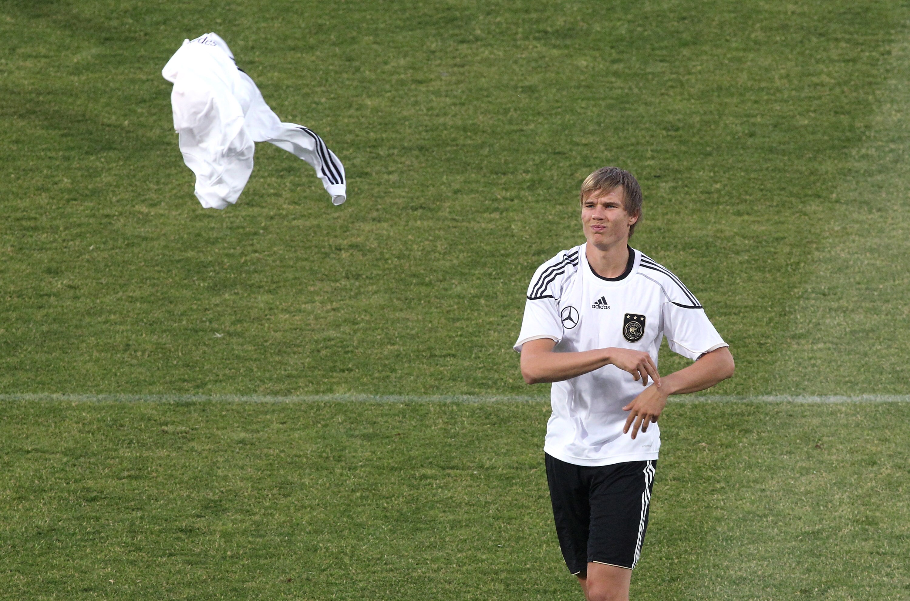 PRETORIA, SOUTH AFRICA - JUNE 25:  Holger Badstuber of Germany throws a jersey during a training session at Super stadium on June 25, 2010 in Pretoria, South Africa.  (Photo by Joern Pollex/Getty Images)
