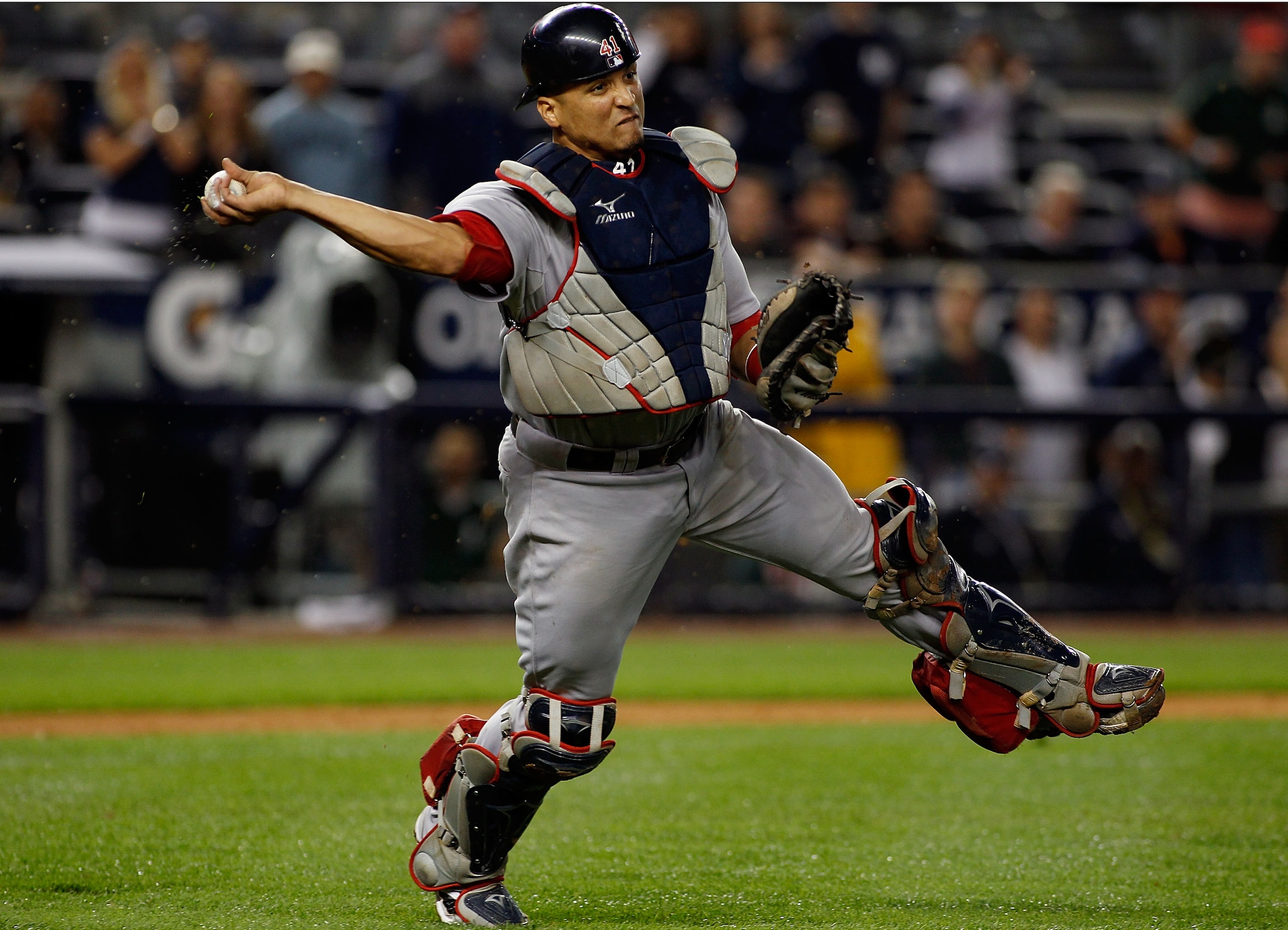 NEW YORK - SEPTEMBER 26:  Victor Martinez #41 of the Boston Red Sox throws the ball away for an error on Brett Gardner (not shown) of the New York Yankees bunt attempt in the 10th inning on September 26, 2010 at Yankee Stadium in the Bronx borough of New 