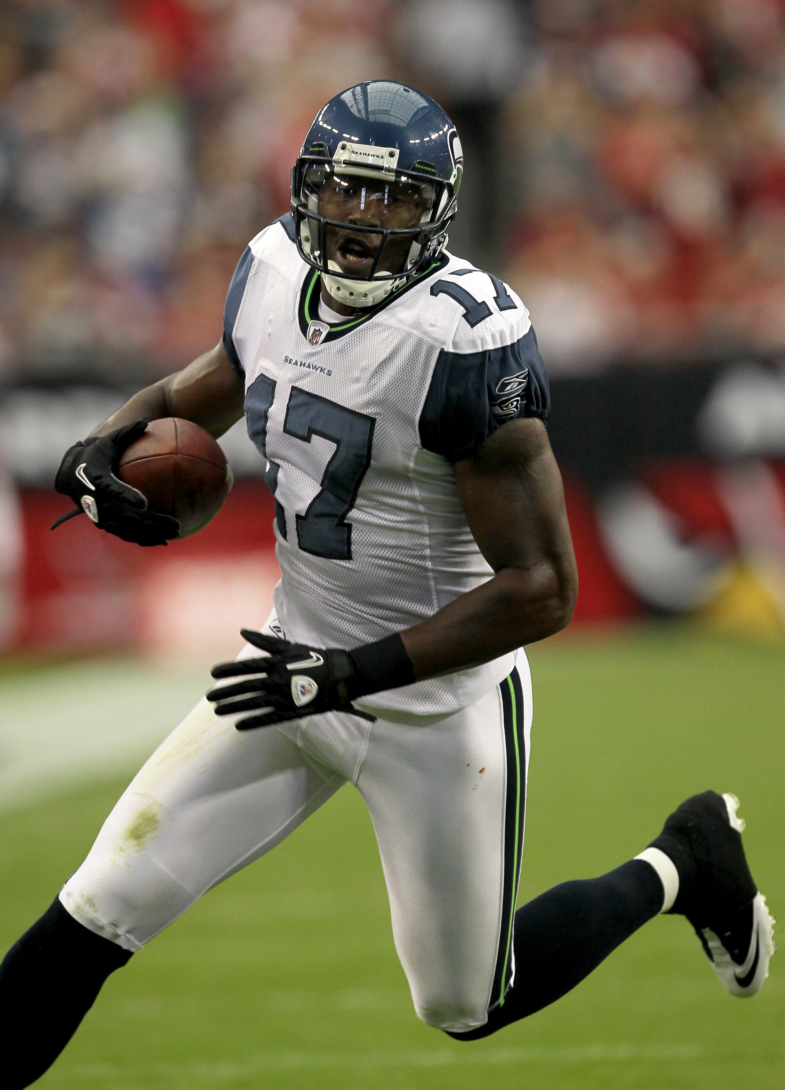 GLENDALE, AZ - NOVEMBER 14:  Wide receiver Mike Williams #17 of the Seattle Seahawks carries the ball against Arizona Cardinals at University of Phoenix Stadium on November 14, 2010 in Glendale, Arizona. Seattle won 36-18.  (Photo by Stephen Dunn/Getty Im