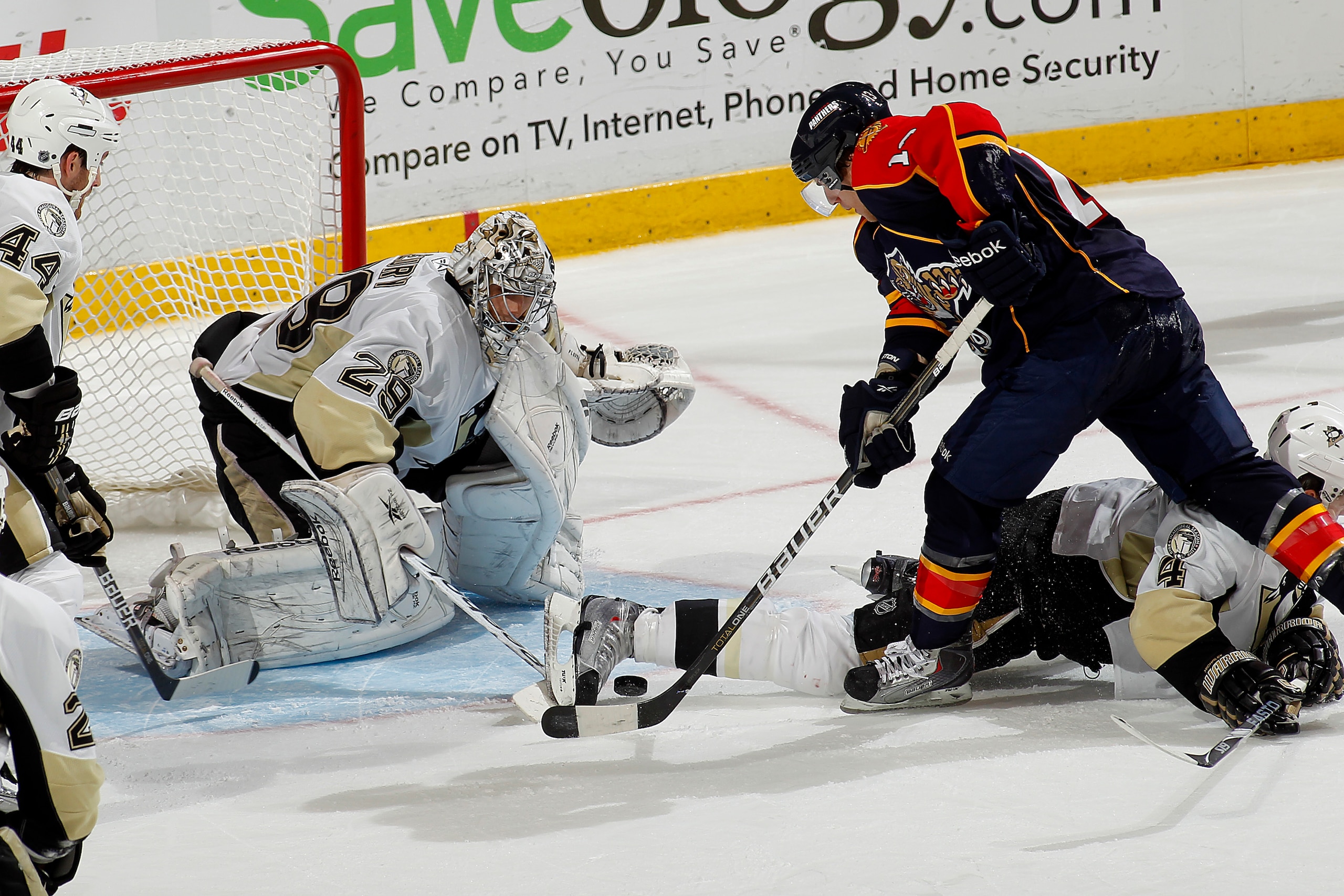 SUNRISE, FL - NOVEMBER 22: Goaltender Marc-Andre Fleury #29 of the Pittsburgh Penguins stops a shot by David Booth #10 of the Florida Panthers in the final minutes of the game on November 22, 2010 at the BankAtlantic Center in Sunrise, Florida. The Pengui SUNRISE, FL - NOVEMBER 22: Goaltender Marc-Andre Fleury #29 of the Pittsburgh Penguins stops a shot by David Booth #10 of the Florida Panthers in the final minutes of the game on November 22, 2010 at the BankAtlantic Center in Sunrise, Florida. The Pengui