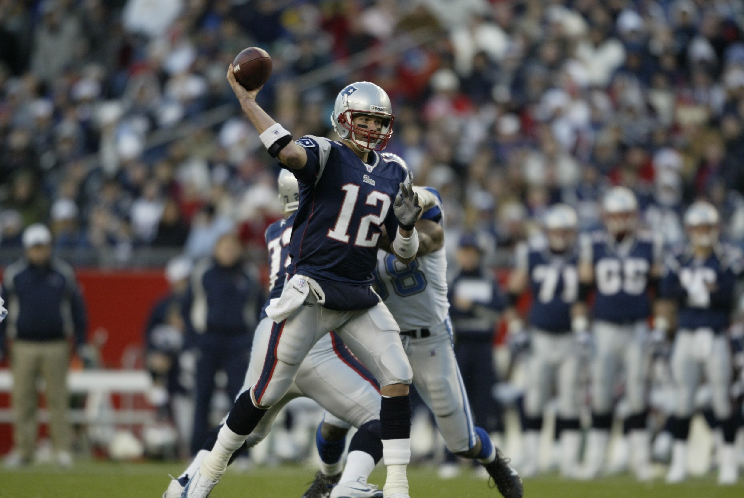 FOXBOROUGH, MA - DECEMBER 3:  Quarterback Tom Brady #12 of the New England Patriots throws a pass against the Detroit Lions on December 3, 2006 at Gillette Stadium in Foxboro, Massachusetts.The Patriots defeated the Lions 28-21.  (Photo by Elsa/Getty Imag