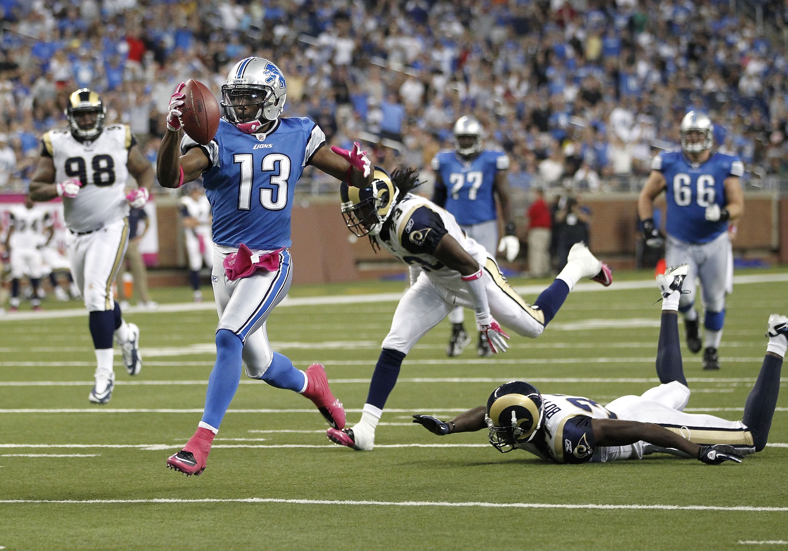 DETROIT - OCTOBER 10: Nate Burleson #13 of the Detroit Lions gets past the St. Louis Rams defense for a third quarter touchdown on October 10, 2010 at Ford Field in Detroit, Michigan. Detroit won the game 44-6. (Photo by Gregory Shamus/Getty Images)