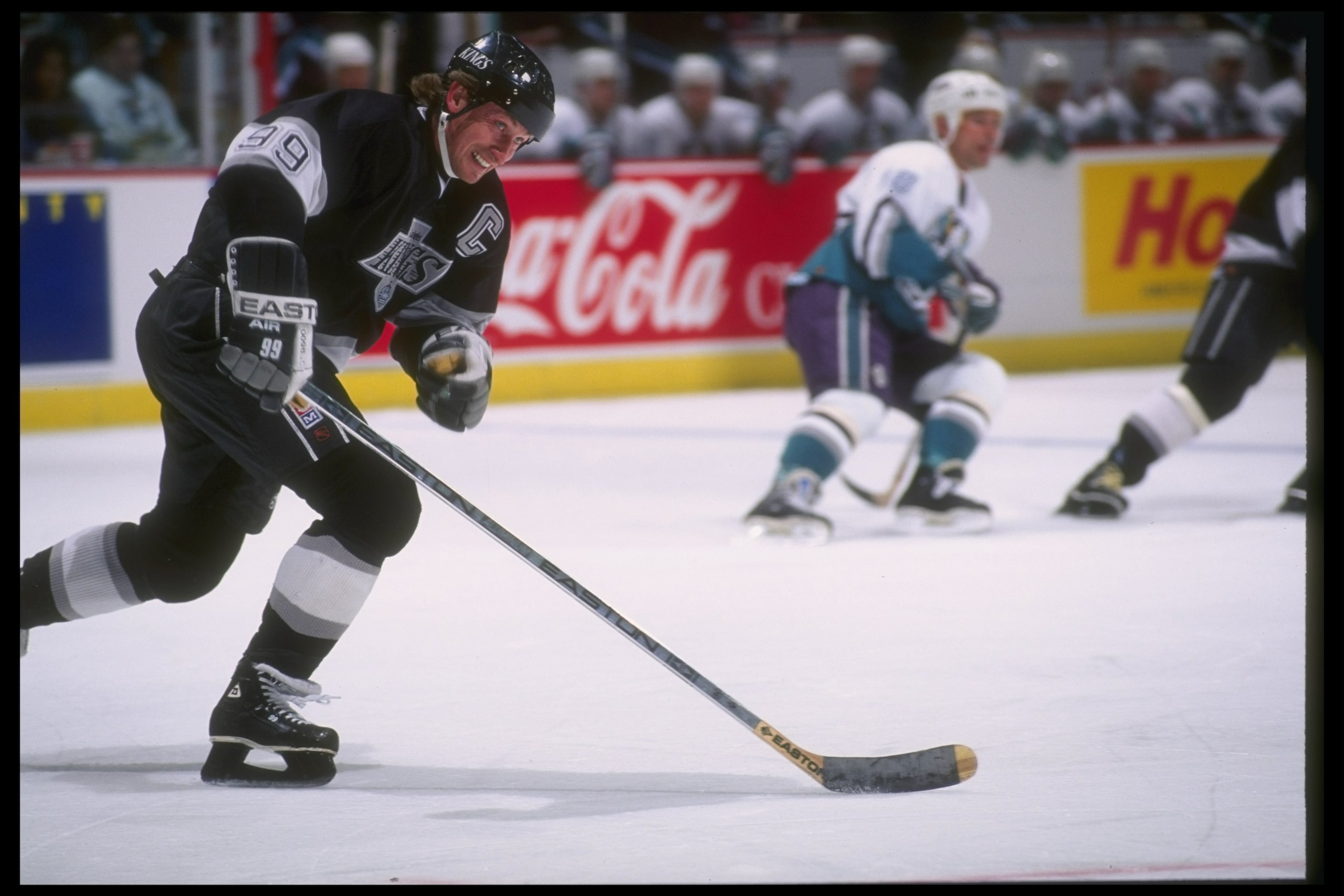 9 Apr 1995: Center Wayne Gretzky of the Los Angeles Kings moves the puck during a game against the Anaheim Mighty Ducks at Arrowhead Pond in Anaheim, California. The Mighty Ducks won the game, 5-1.