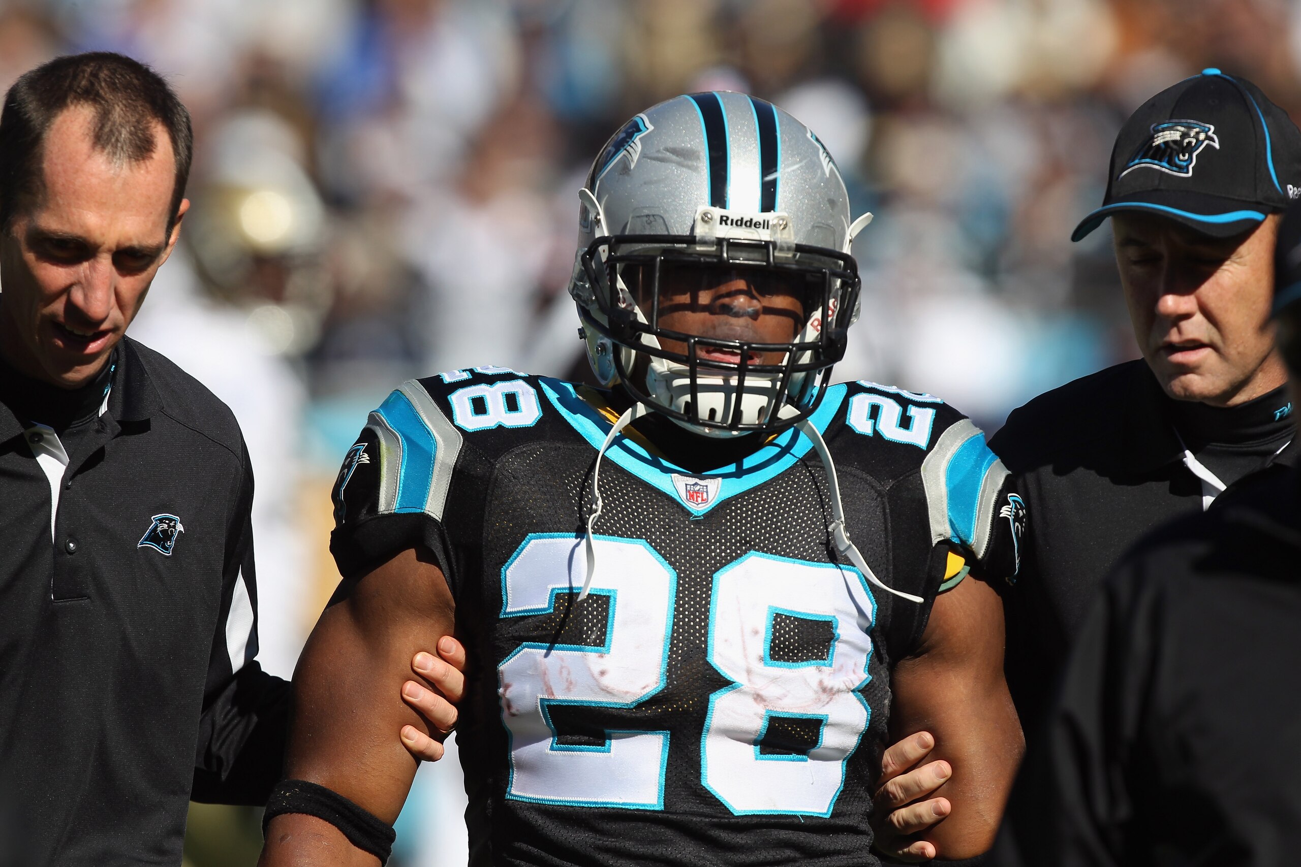 CHARLOTTE, NC - NOVEMBER 07:  Jonathan Stewart #28 of the Carolina Panthers is helped off the field after an injury during their game against the New Orleans Saints at Bank of America Stadium on November 7, 2010 in Charlotte, North Carolina.  (Photo by St
