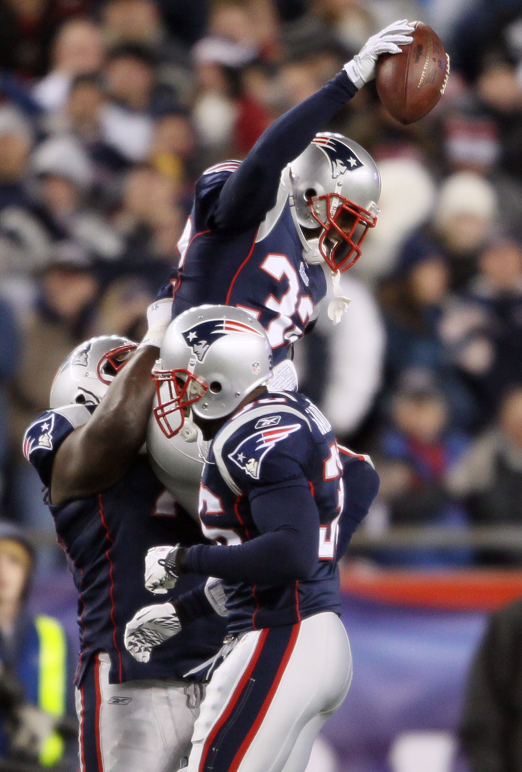FOXBORO, MA - NOVEMBER 21:   Devin McCourty #32 of the New England Patriots celebrates with teammates Kyle Love #74 and James Sanders #36 after McCourty intercepted a pass from the Indianapolis Colts on November 21, 2010 at Gillette Stadium in Foxboro, Ma