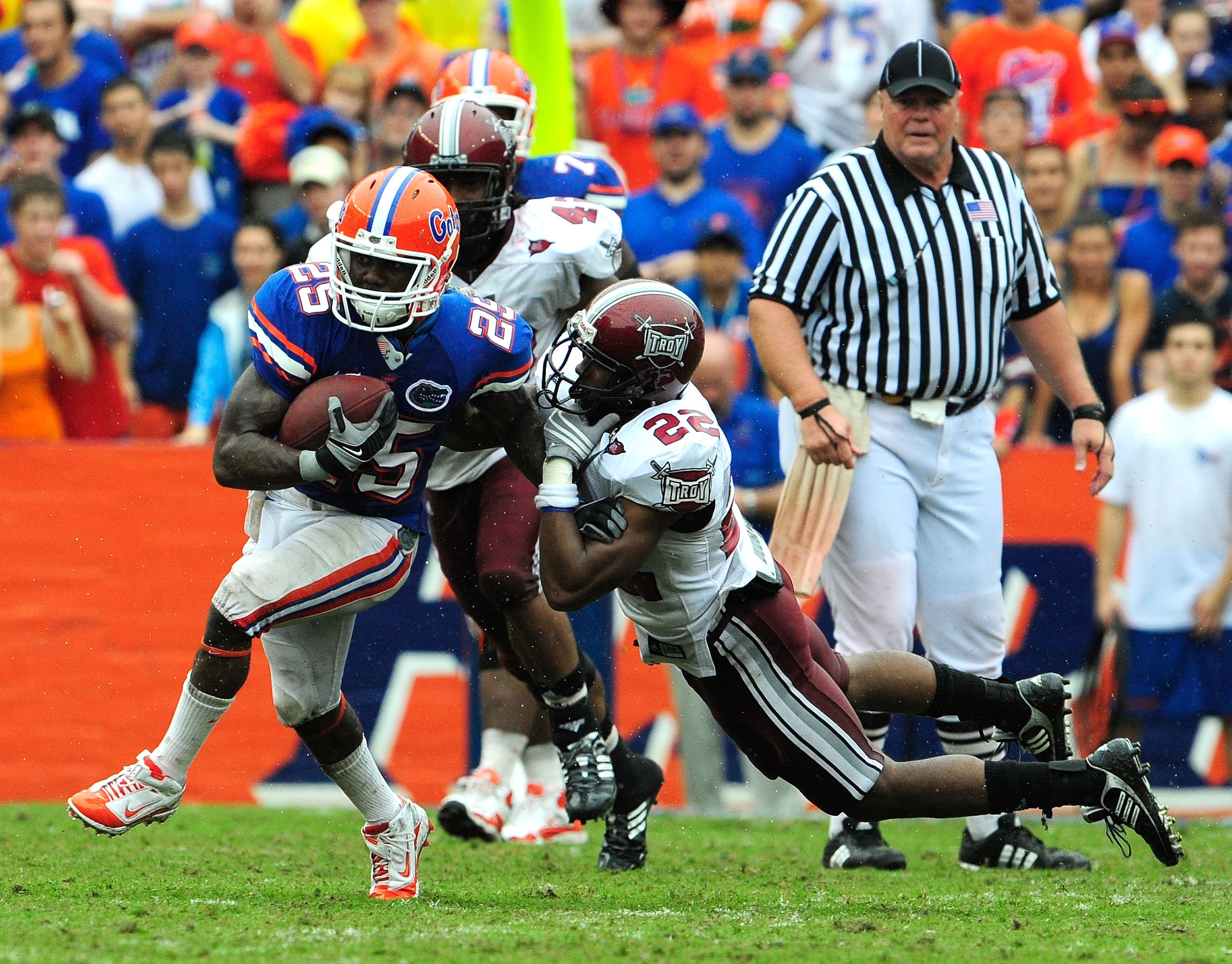 GAINESVILLE, FL - SEPTEMBER 12: Brandon James #25 of the Florida Gators breaks the tackle of John Birmingham #22 of the Troy Trojans during the game at Ben Hill Griffin Stadium on September 12, 2009 in Gainesville, Florida. (Photo by Sam Greenwood/Getty GAINESVILLE, FL - SEPTEMBER 12: Brandon James #25 of the Florida Gators breaks the tackle of John Birmingham #22 of the Troy Trojans during the game at Ben Hill Griffin Stadium on September 12, 2009 in Gainesville, Florida. (Photo by Sam Greenwood/Getty