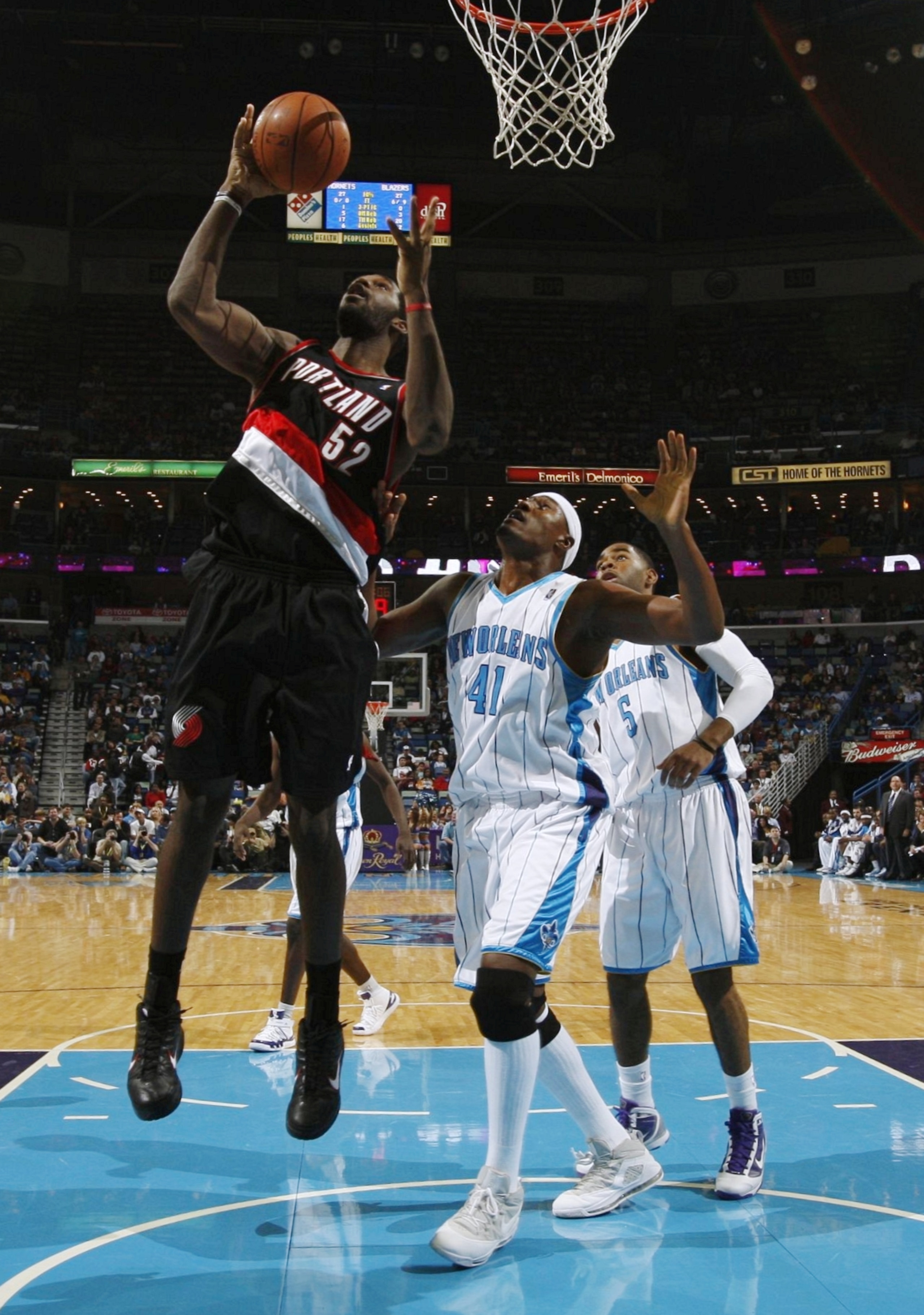 NEW ORLEANS - NOVEMBER 13:  Greg Oden #52 of the Portland Trail Blazers rebounds the ball against James Posey #41 of the New Orleans Hornets during the game at New Orleans Arena on November 13, 2009 in New Orleans, Louisiana.  NOTE TO USER: User expressly