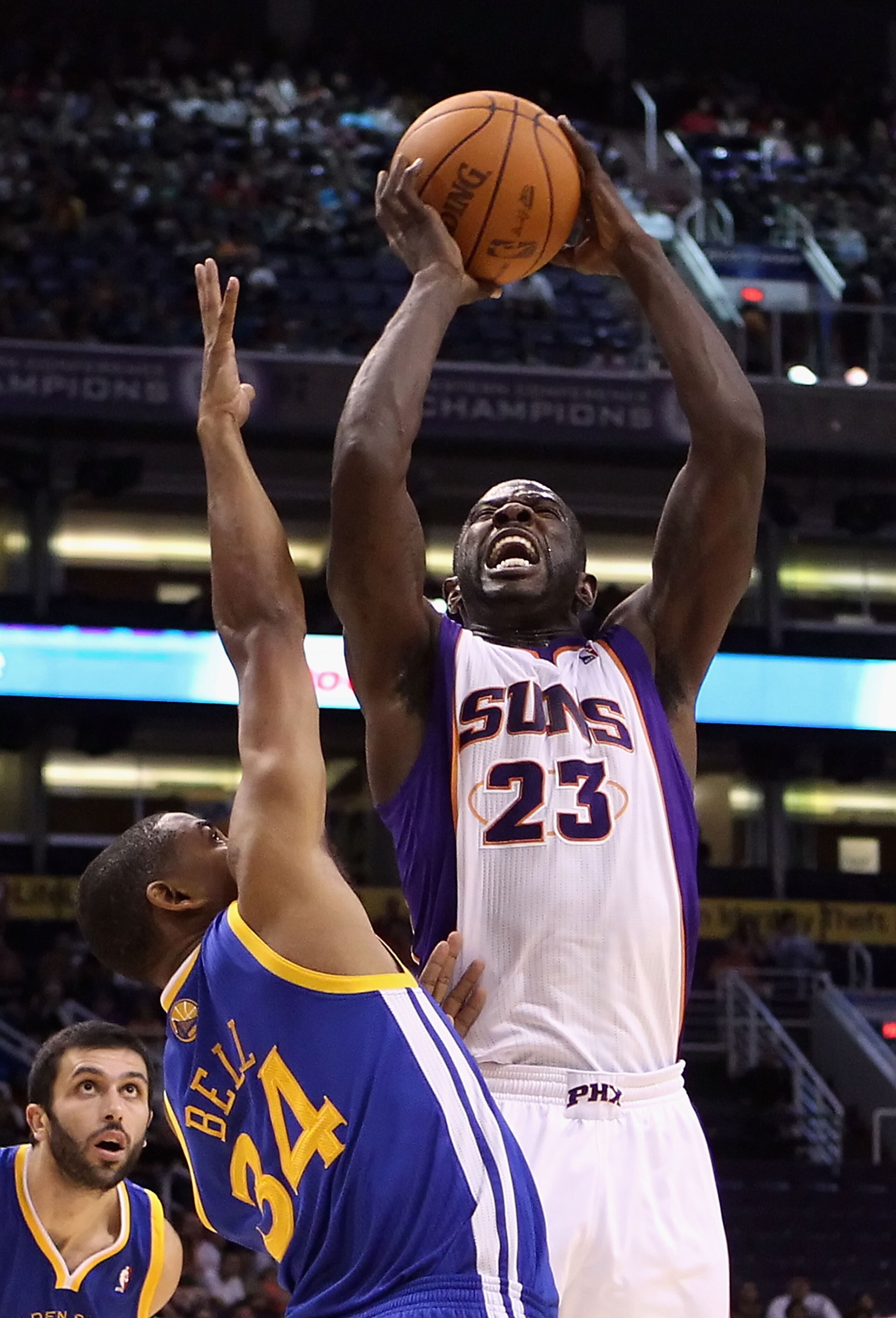 PHOENIX - OCTOBER 19:  Jason Richardson #23 of the Phoenix Suns attempts a shot over Charlie Bell #34 of the Golden State Warriors during the preseason NBA game at US Airways Center on October 19, 2010 in Phoenix, Arizona. NOTE TO USER: User expressly ack